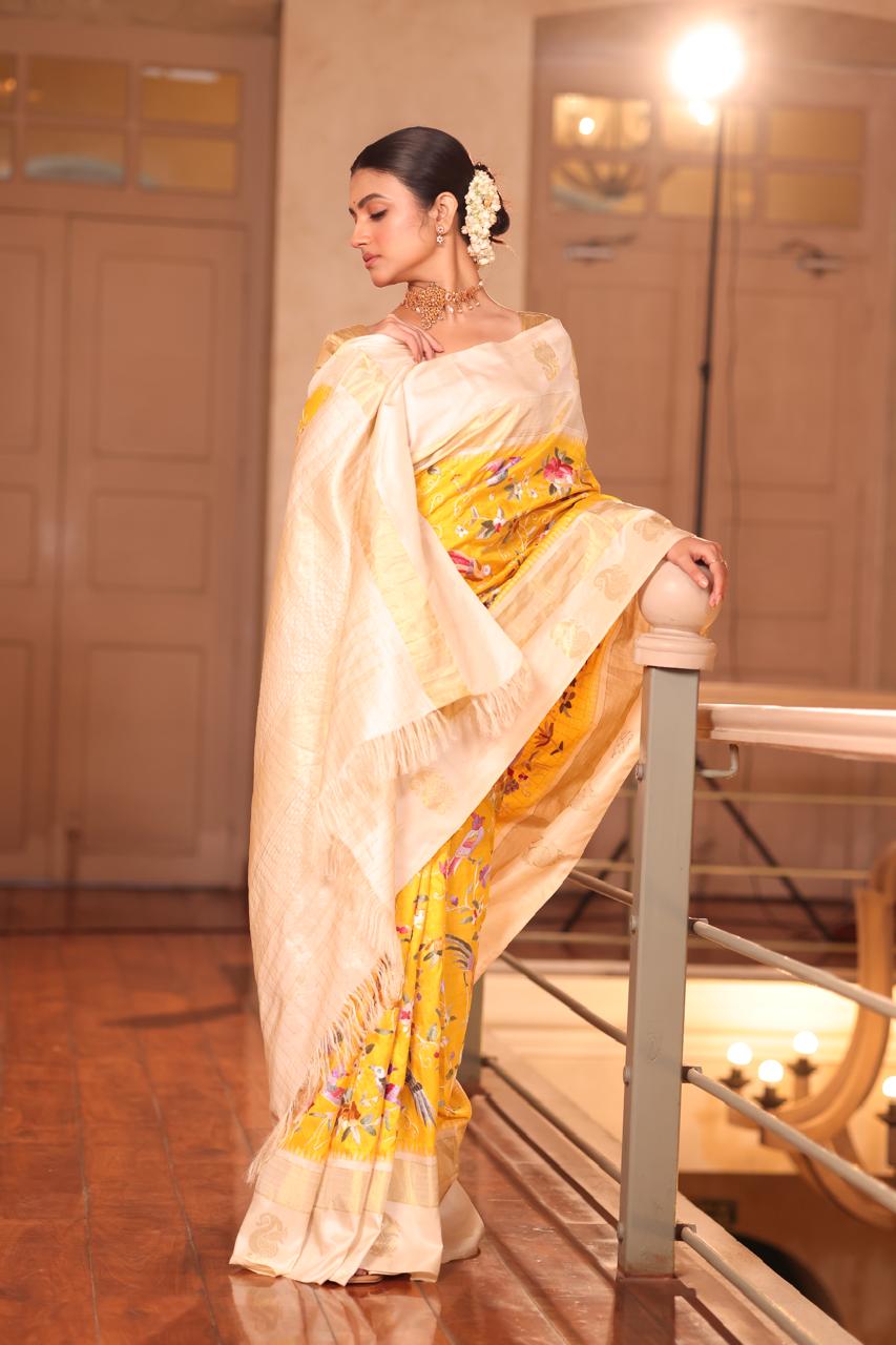 A pastel yellow Masterpiece kanchivaram weave silk saree with authentic Parsi gara work