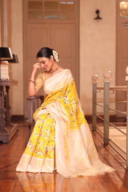 A pastel yellow Masterpiece kanchivaram weave silk saree with authentic Parsi gara work