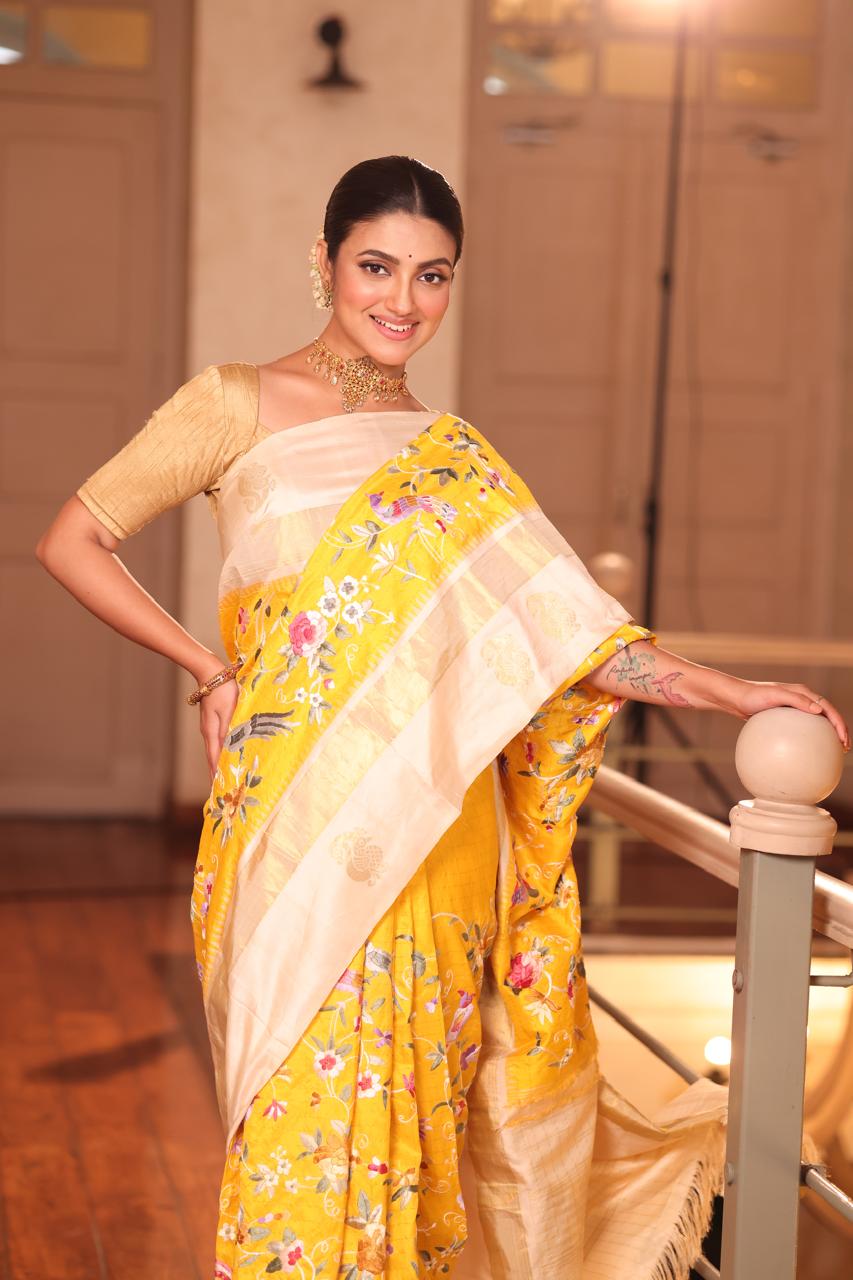 A pastel yellow Masterpiece kanchivaram weave silk saree with authentic Parsi gara work