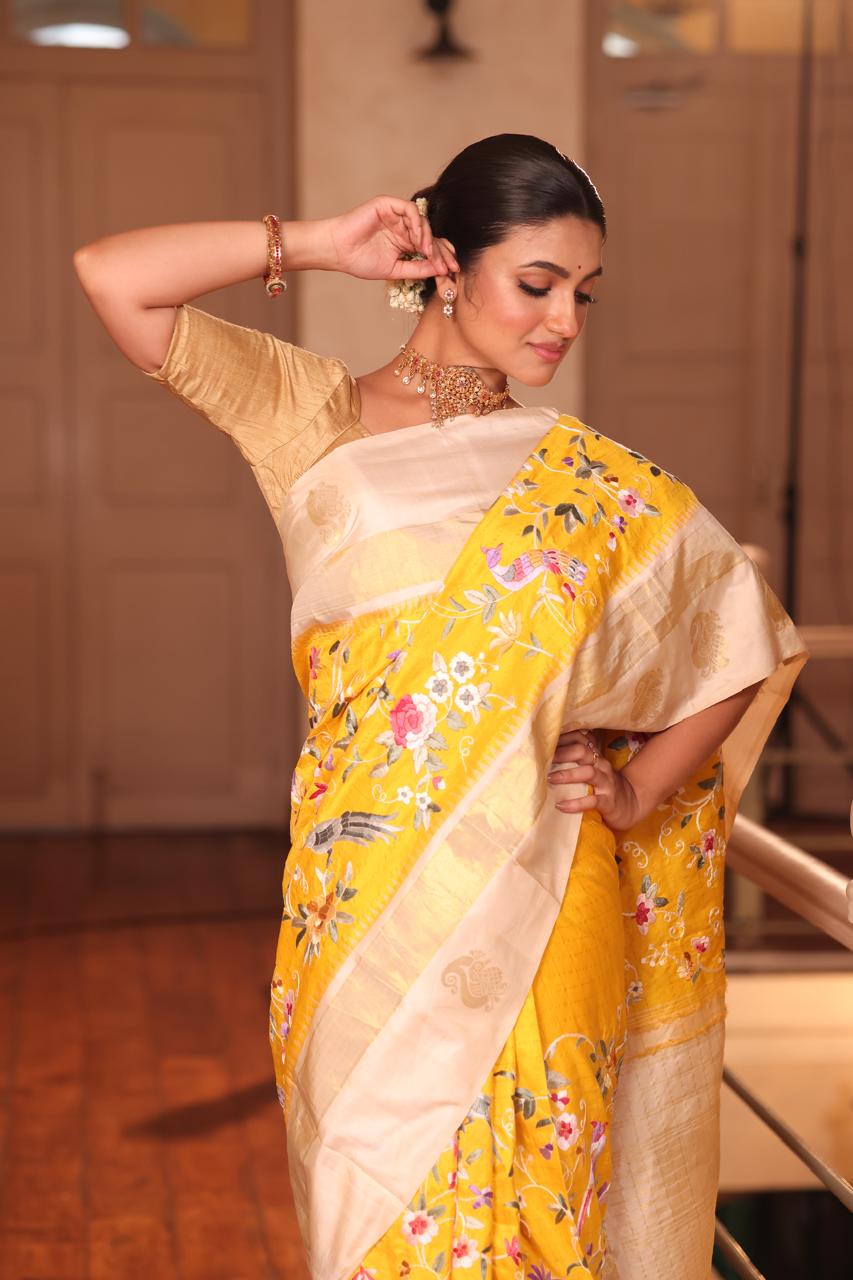 A pastel yellow Masterpiece kanchivaram weave silk saree with authentic Parsi gara work