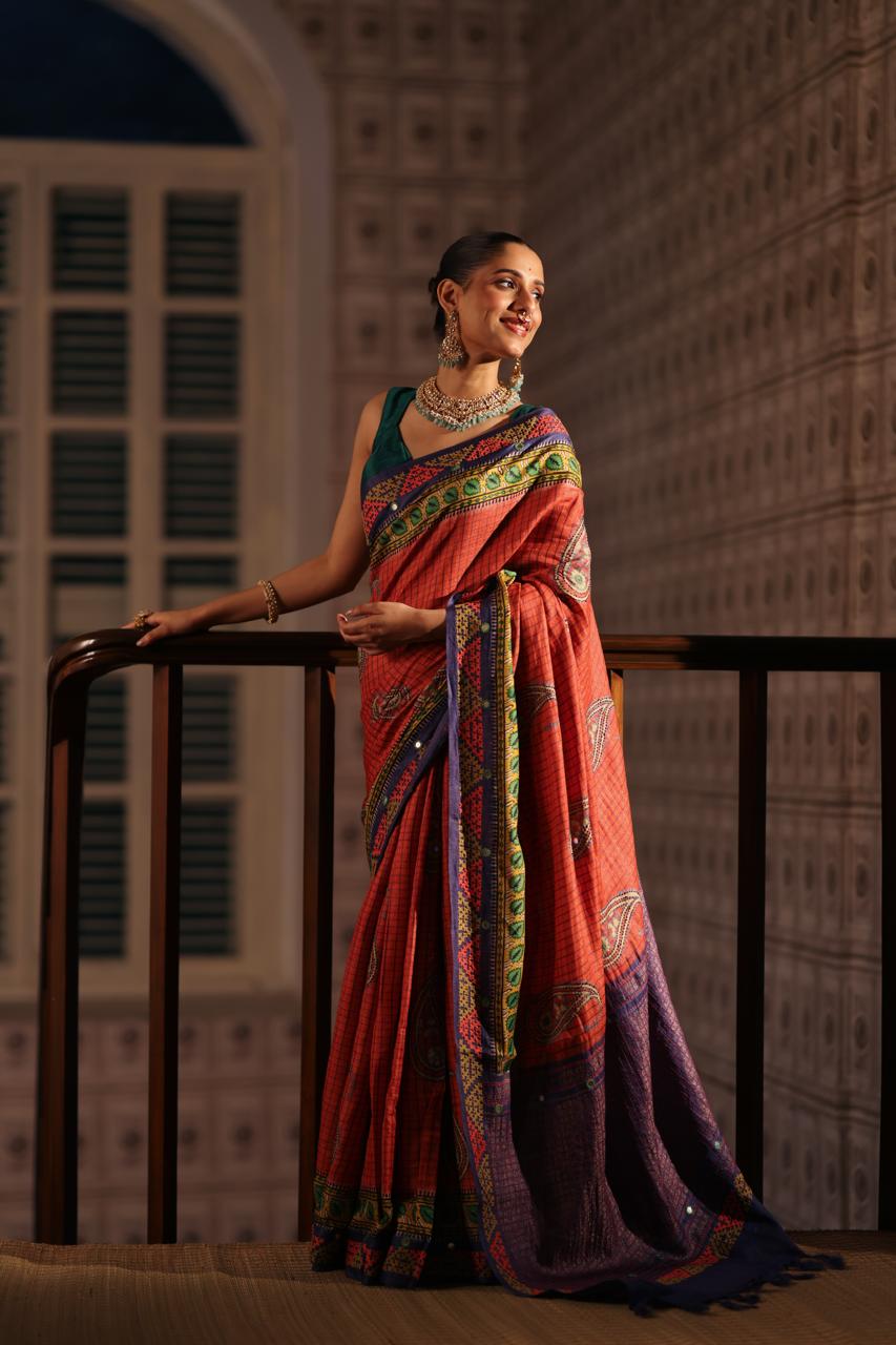 Block prints and kutch mirrorwork highlights on zari woven tussar silk saree