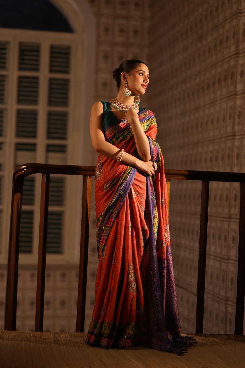 Block prints and kutch mirrorwork highlights on zari woven tussar silk saree