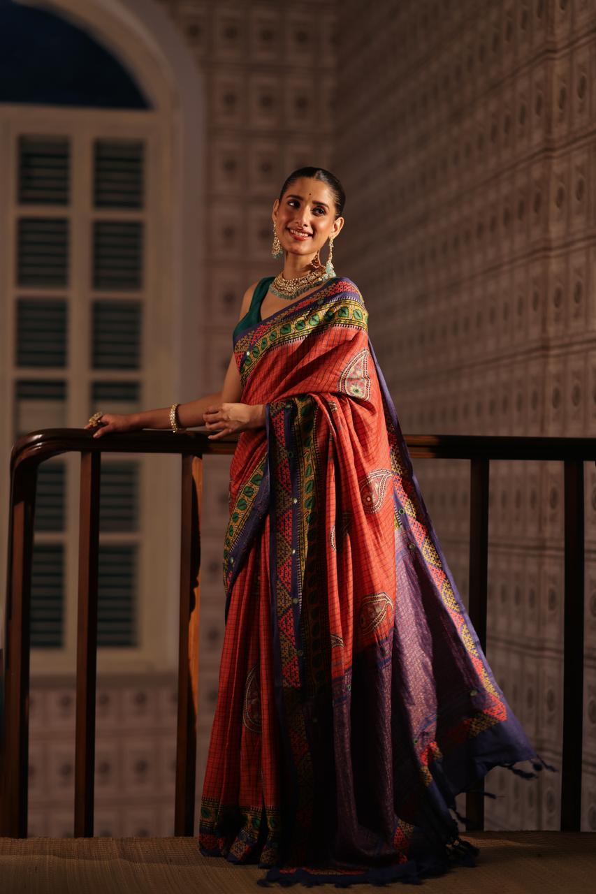Block prints and kutch mirrorwork highlights on zari woven tussar silk saree