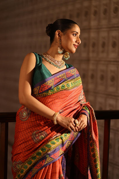 Block prints and kutch mirrorwork highlights on zari woven tussar silk saree