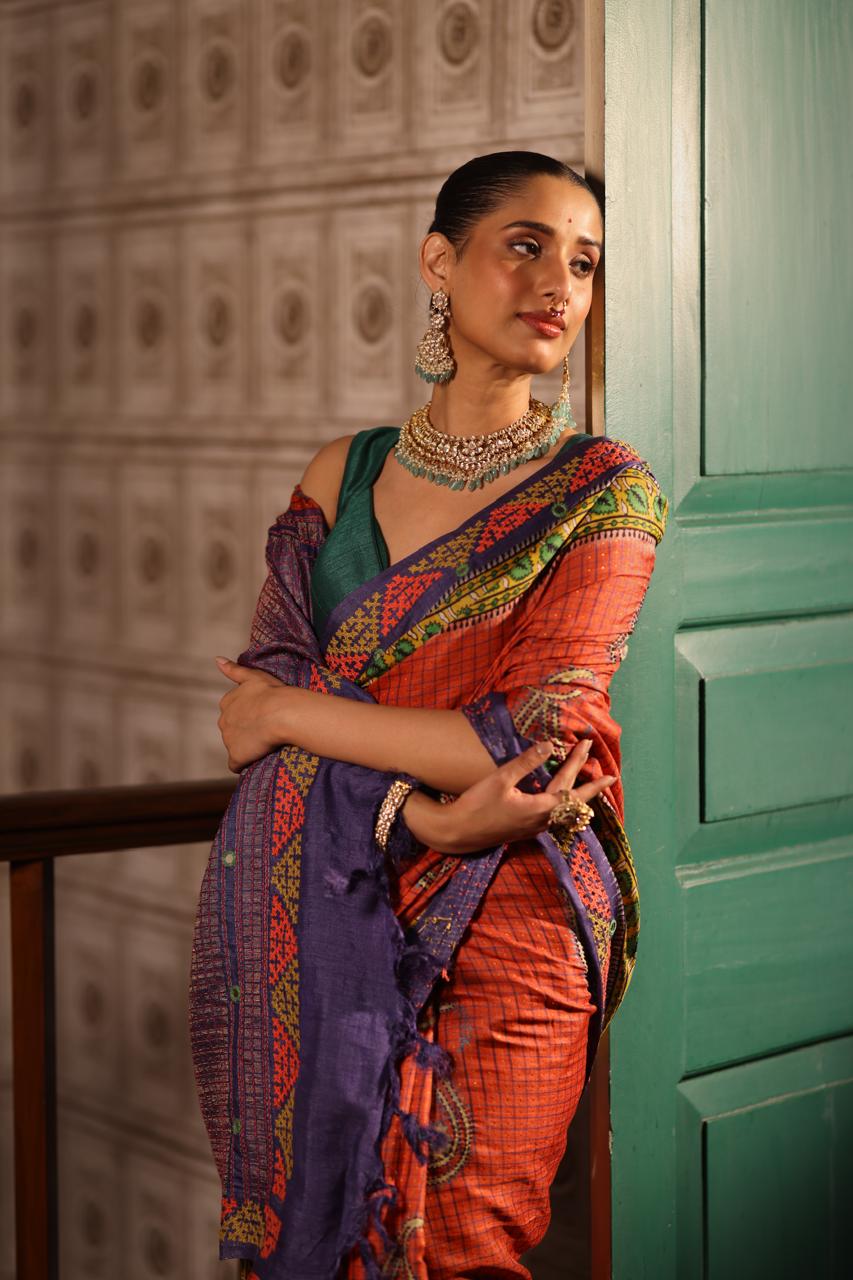 Block prints and kutch mirrorwork highlights on zari woven tussar silk saree