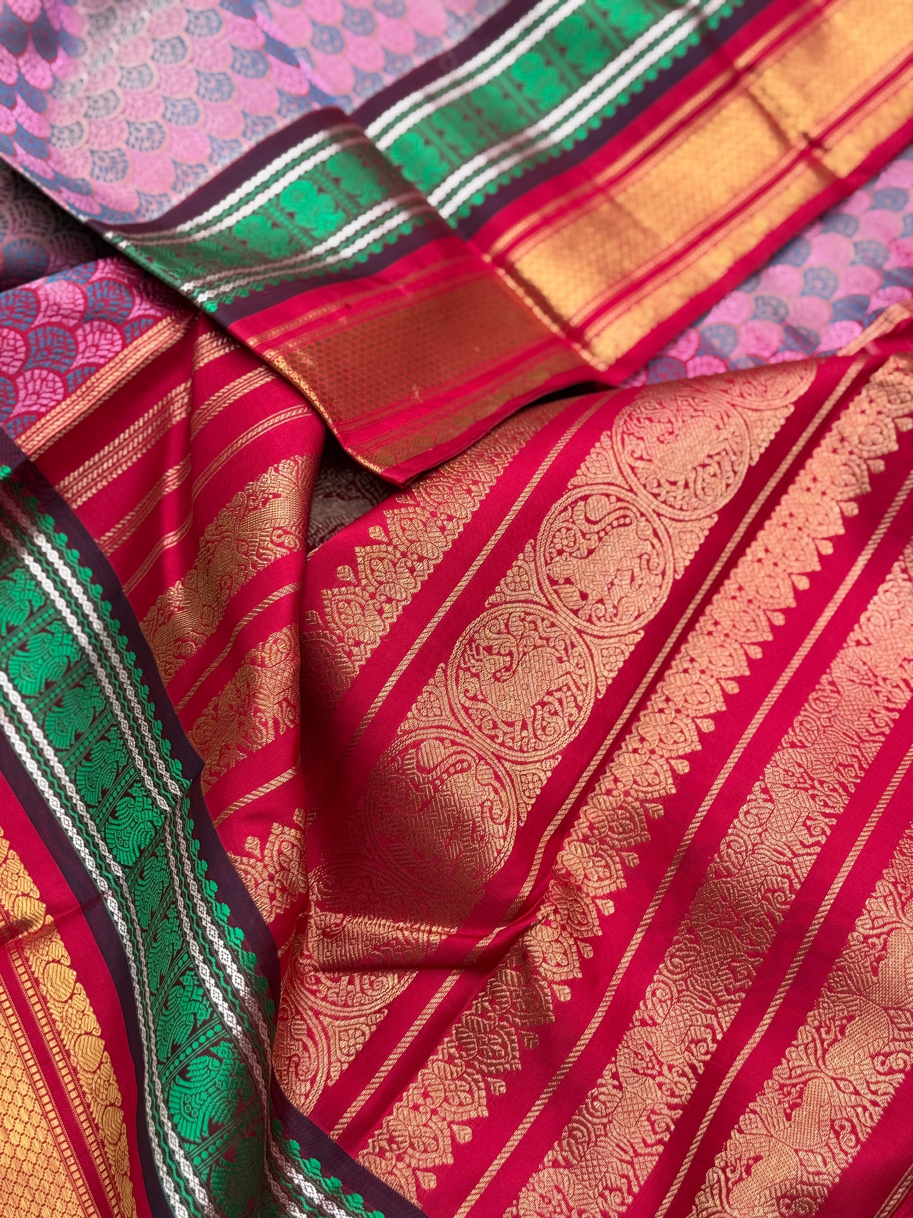 A stunner Masterpiece double border  kanchivaram woven silk saree in mauve pink green red