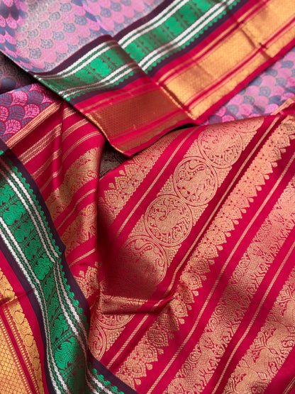 A stunner Masterpiece double border  kanchivaram woven silk saree in mauve pink green red