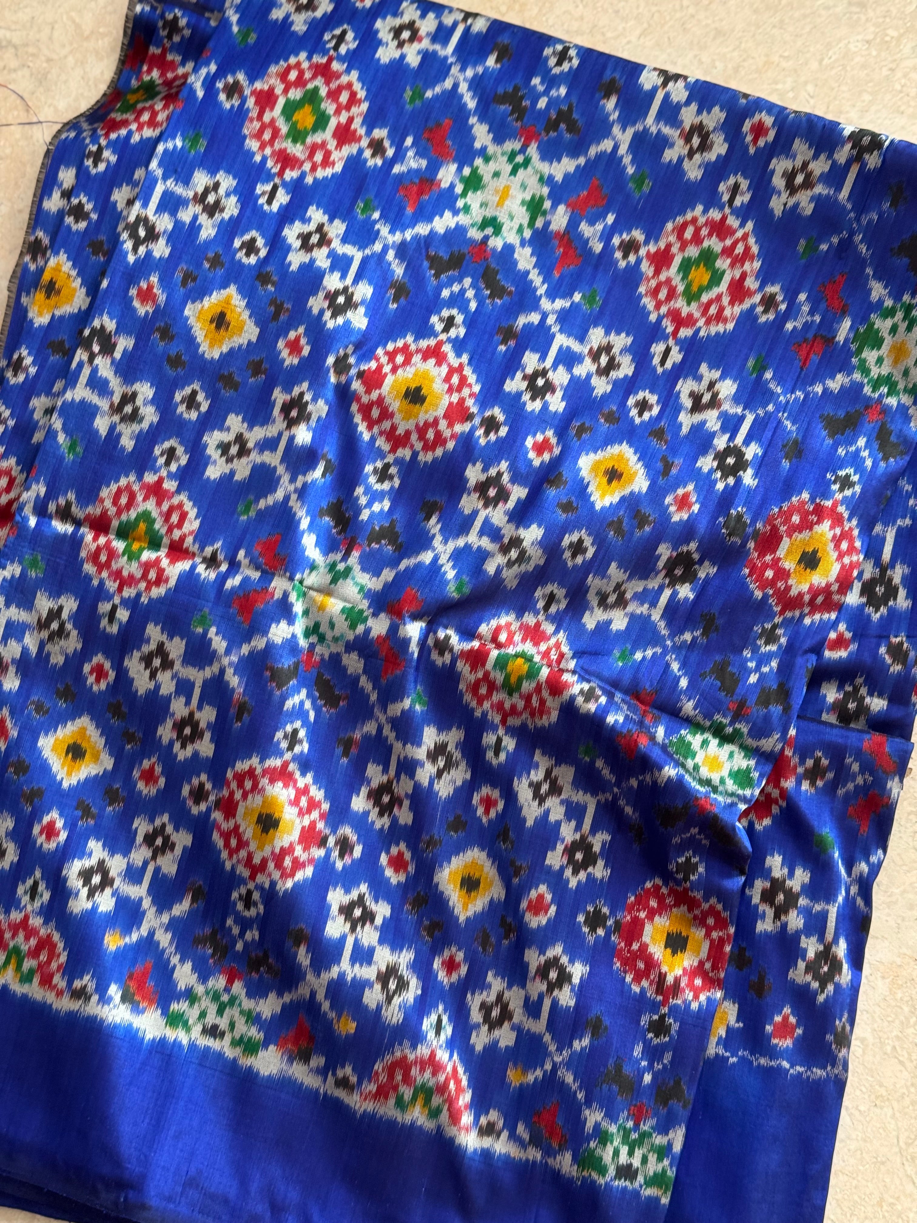 Blue patola inspired navratan ikkat design on pure mulberry silk fabric