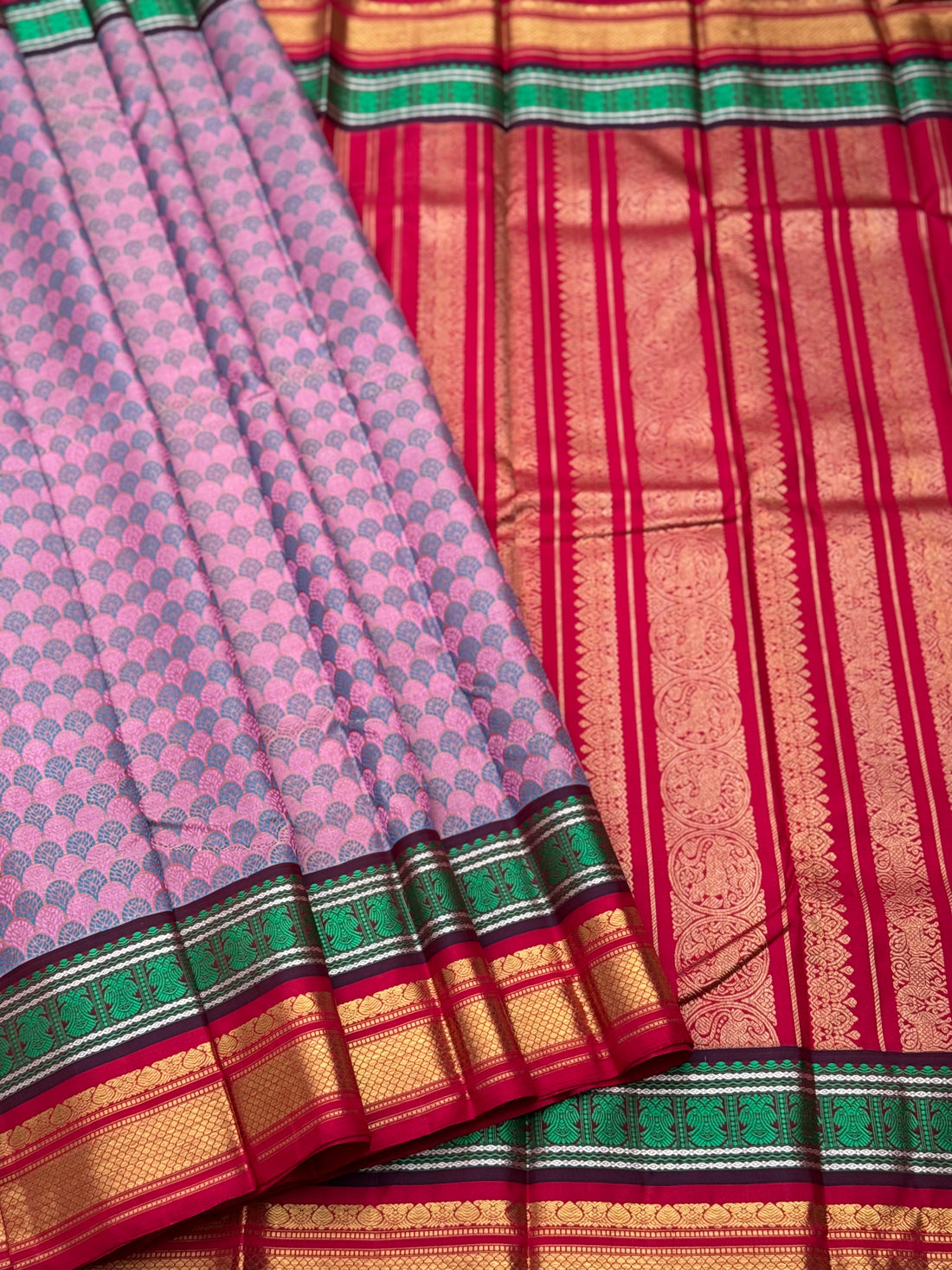 A stunner Masterpiece double border  kanchivaram woven silk saree in mauve pink green red