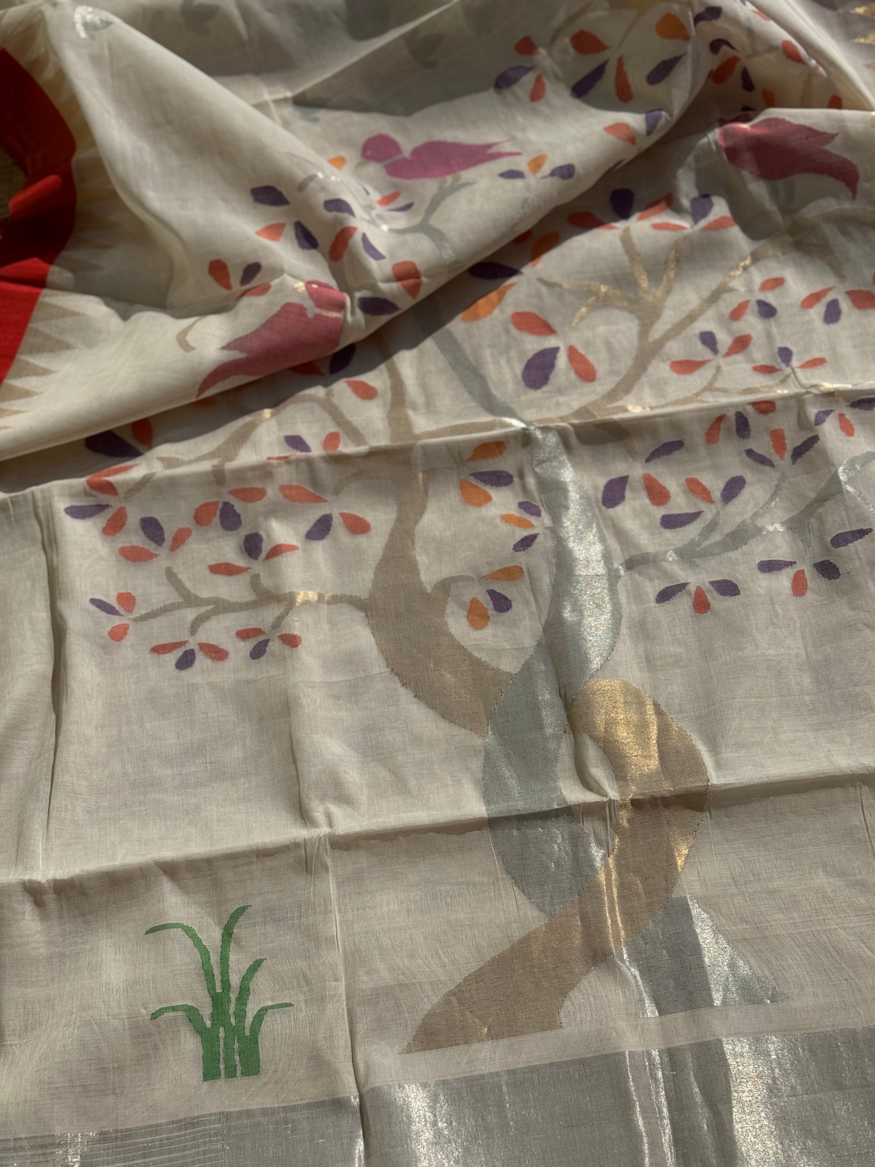 Handspun Ponduru Khadhi Jaal Jamdani Saree in pristine white with silver