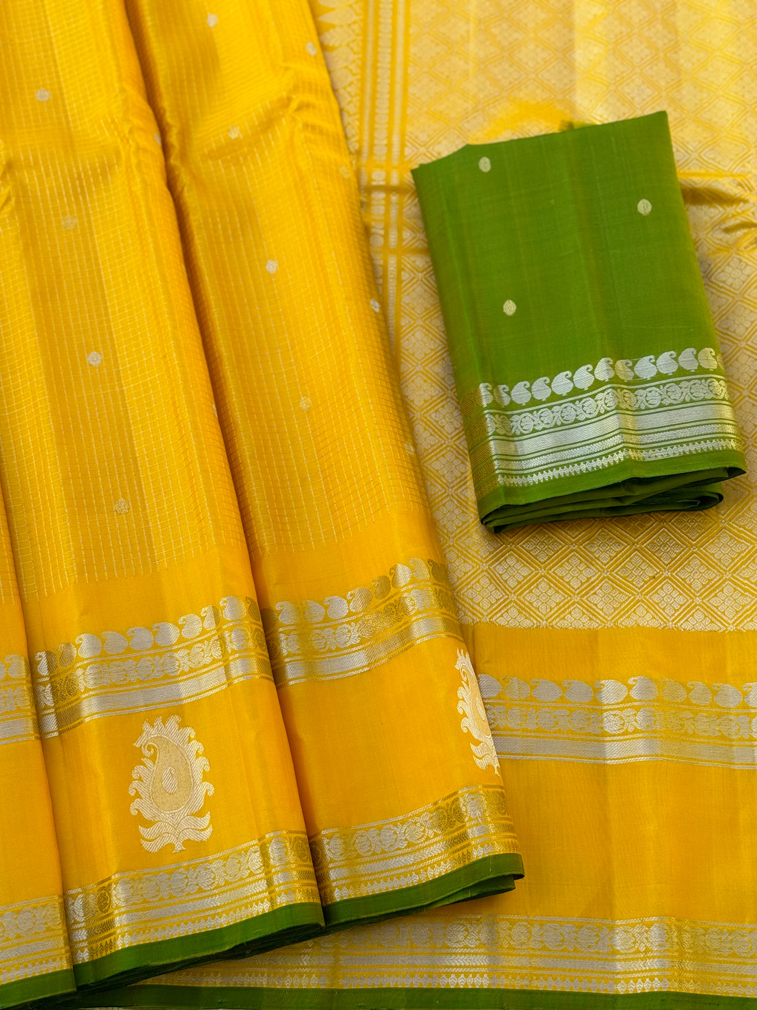 The complete handwoven lemon yellow silver zari checks pure gadwal silk saree