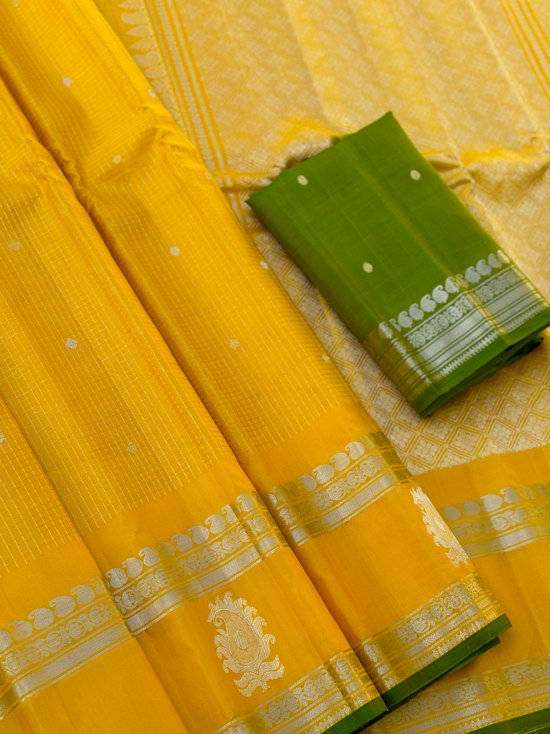 The complete handwoven lemon yellow silver zari checks pure gadwal silk saree
