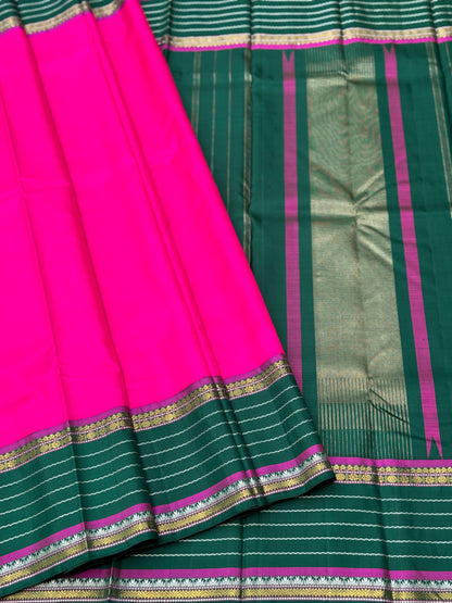 The masterfully crafted neli veldhari Kanchivaram silk saree features subtle pattu rose pink