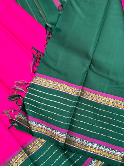 The masterfully crafted neli veldhari Kanchivaram silk saree features subtle pattu rose pink
