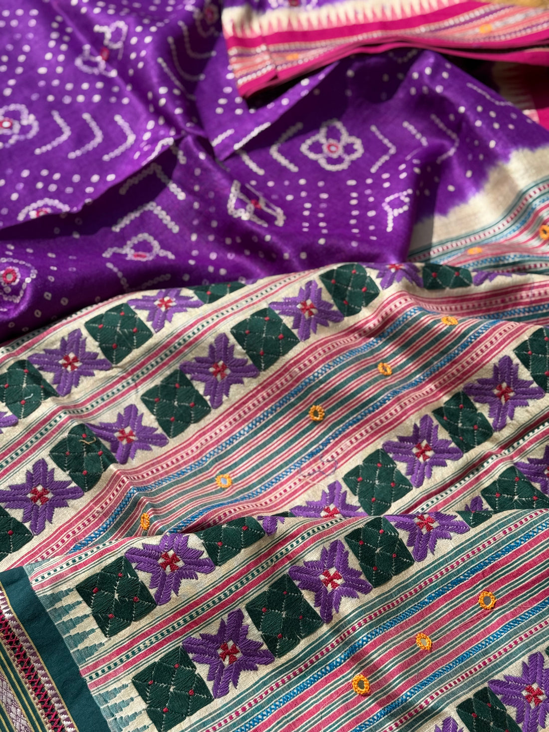 An exquisite handwoven vidharbha tussar silk saree with karvati kinar border intricately tie dyed with brinjal purple blue bhandhej and phulkari hand embroidered