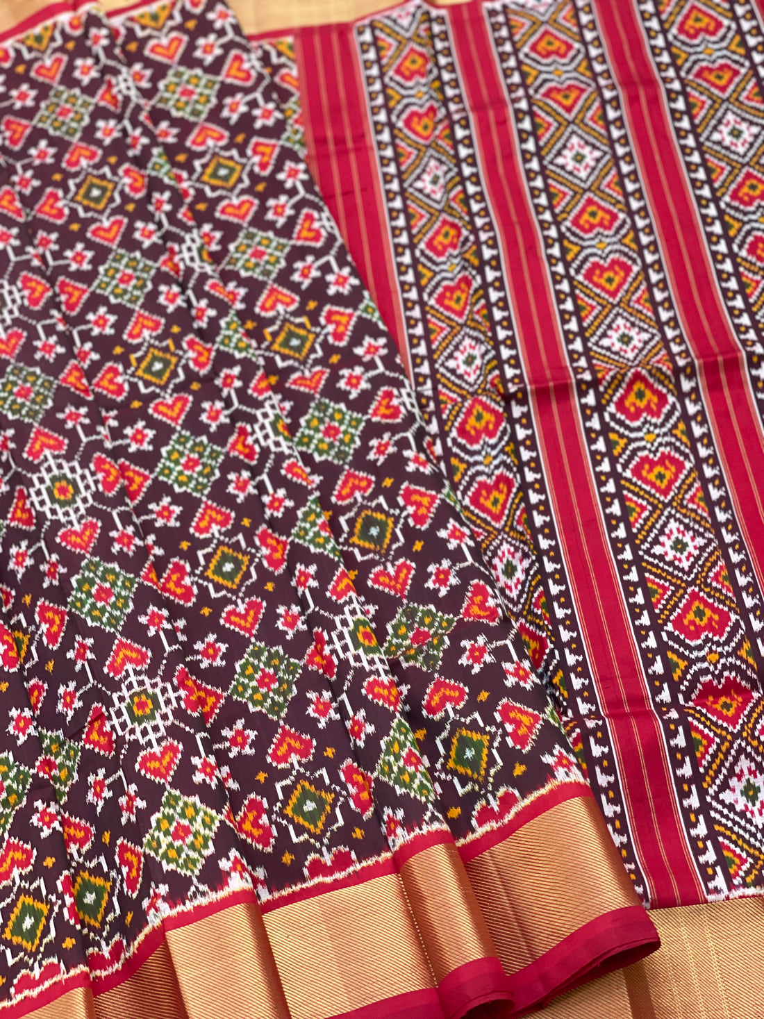 A Traditional Patola inspired silk ikkat saree with navrathan motifs