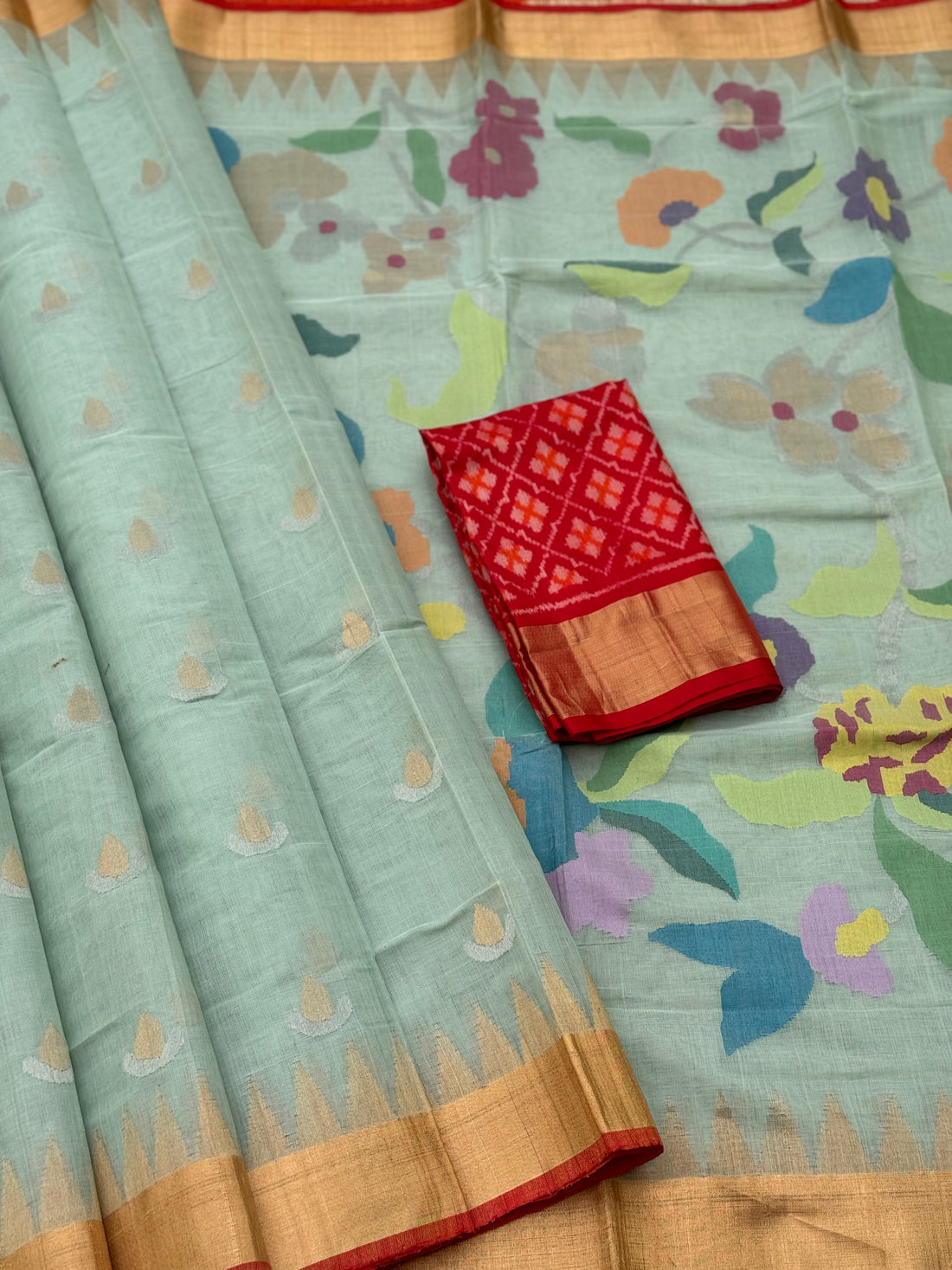 A gorgeous pastel mint shade handspun ponduru Khadhi jamdani cotton saree