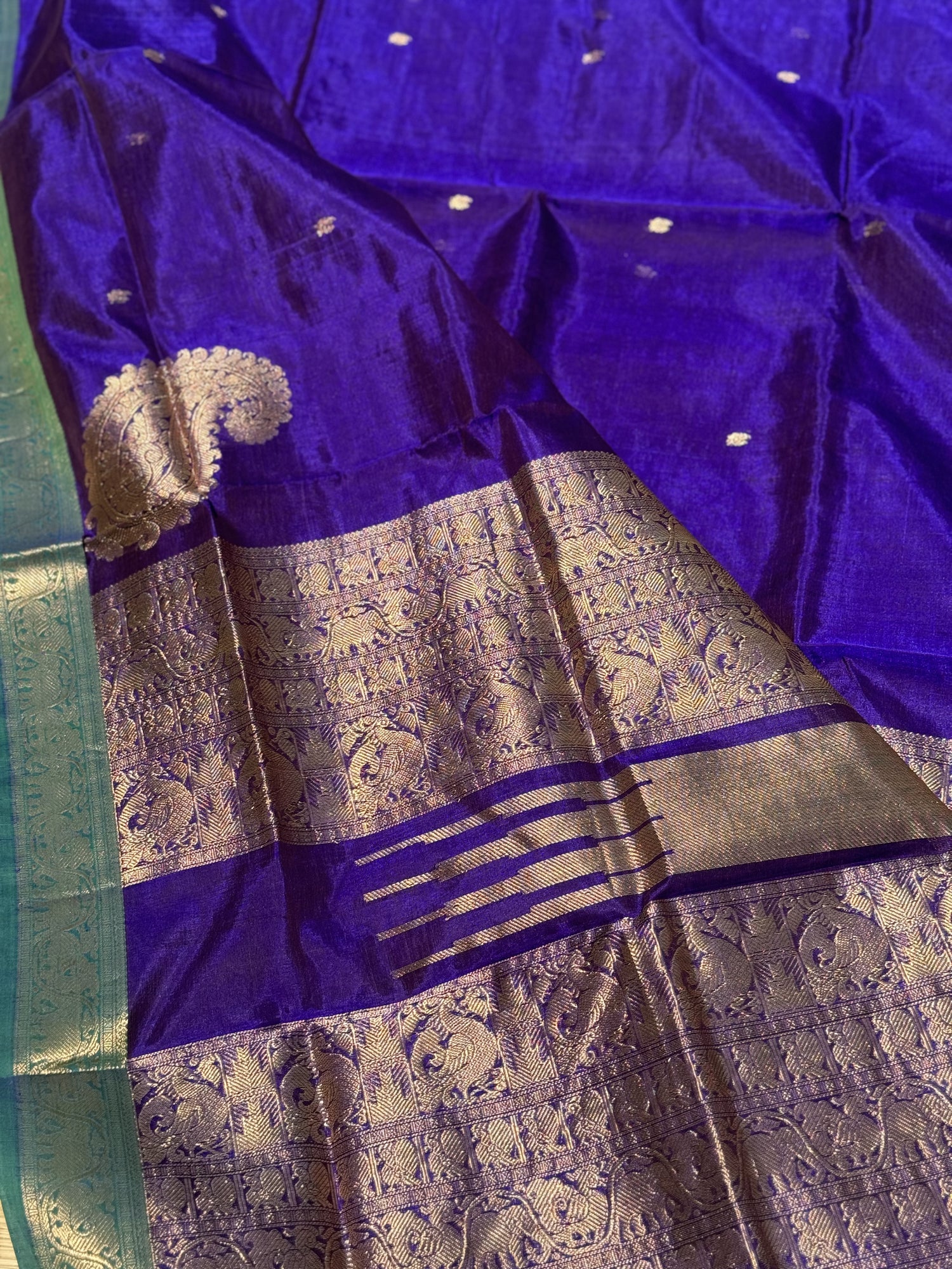 A gorgeous royal blue kanchi silk cotton saree with paisley mango conia butta
