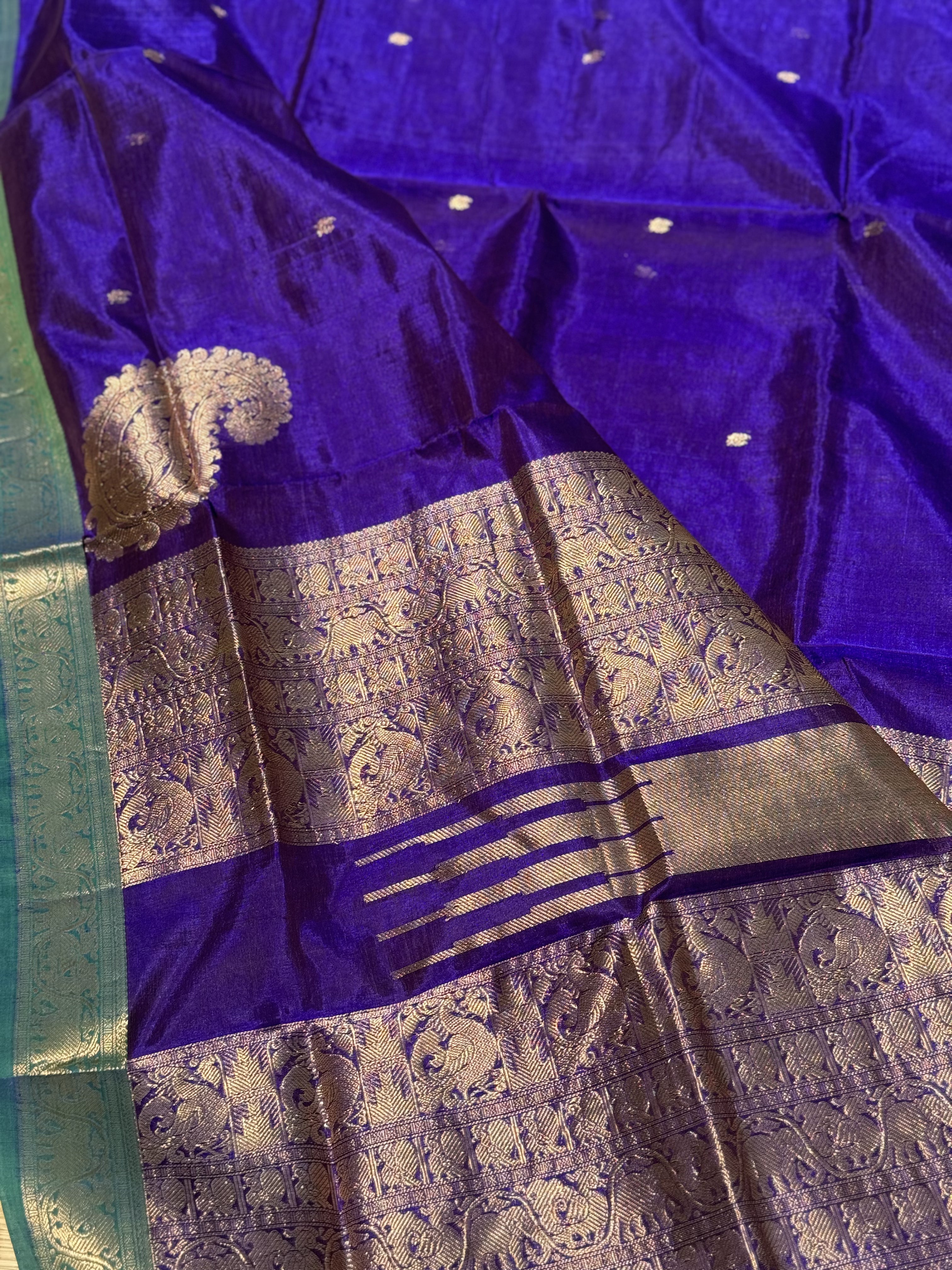 A gorgeous royal blue kanchi silk cotton saree with paisley mango conia butta