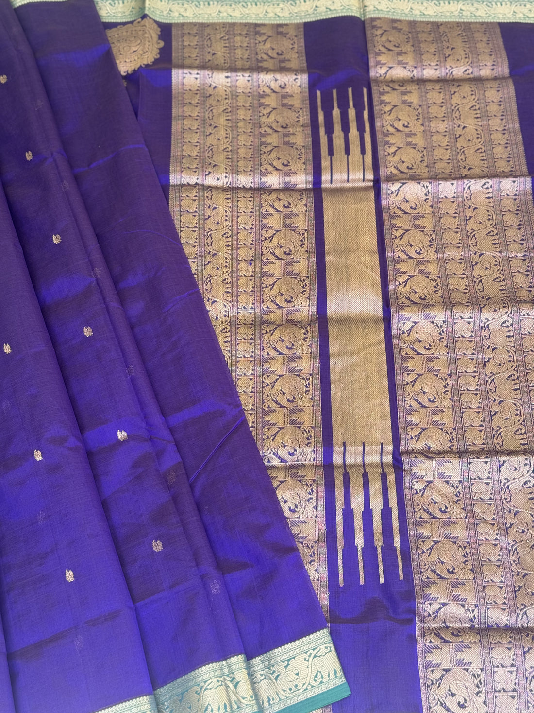 A gorgeous royal blue kanchi silk cotton saree with paisley mango conia butta