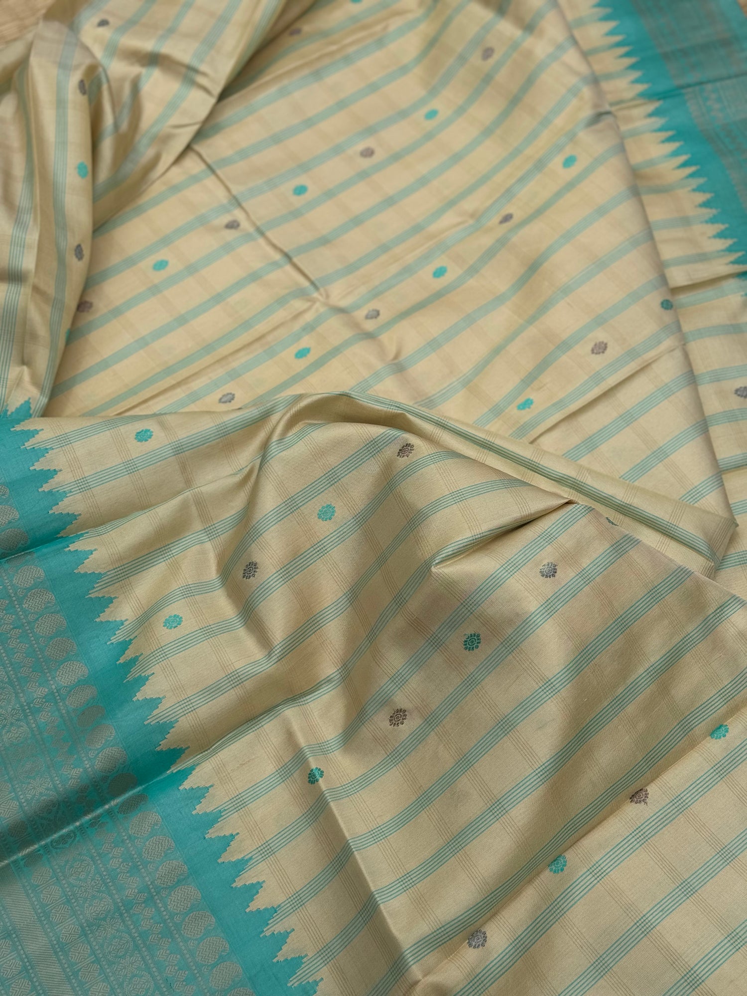 A gorgeous No Zari seagreen with ivory handwoven gadwal silk saree