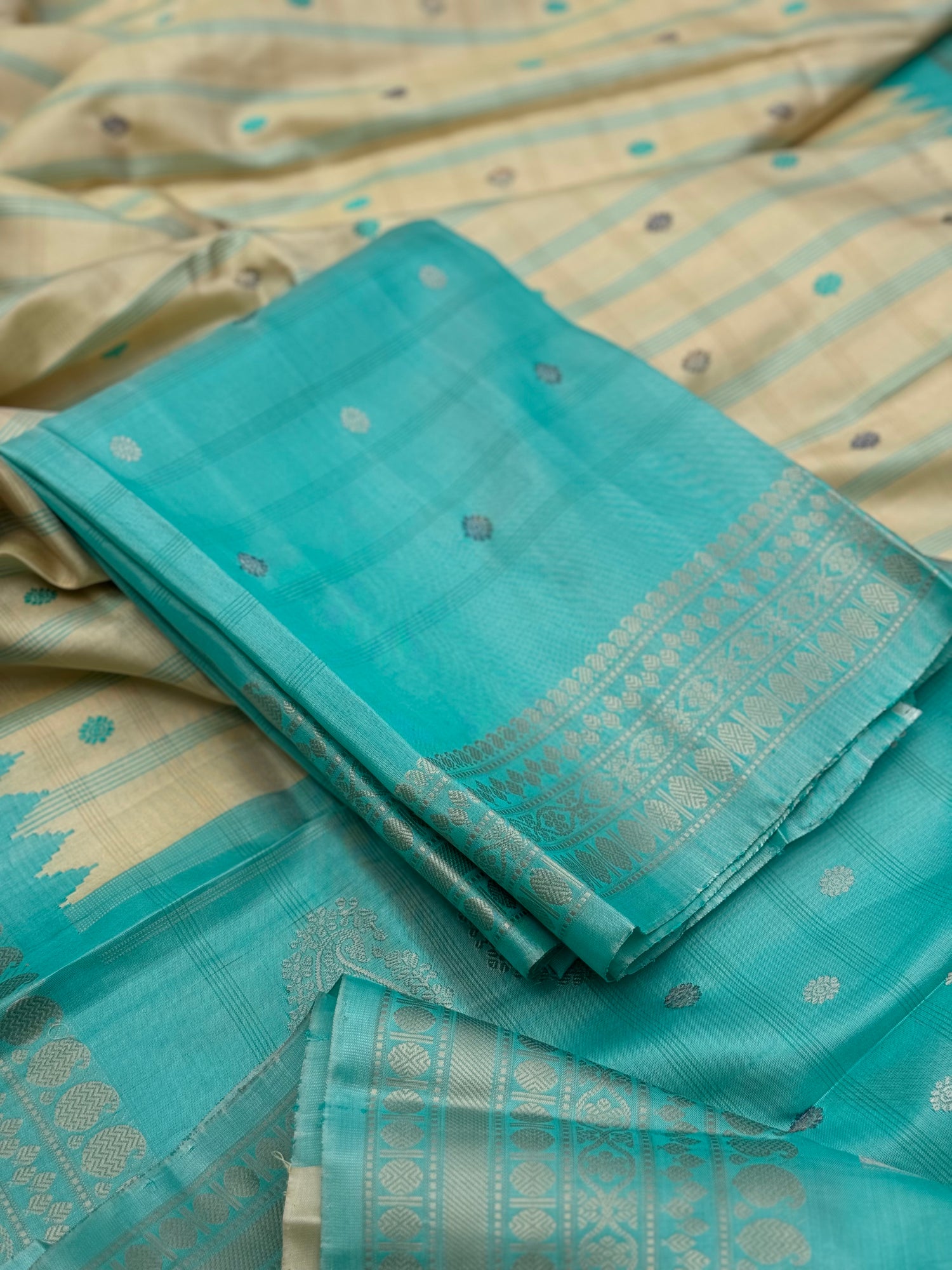 A gorgeous No Zari seagreen with ivory handwoven gadwal silk saree
