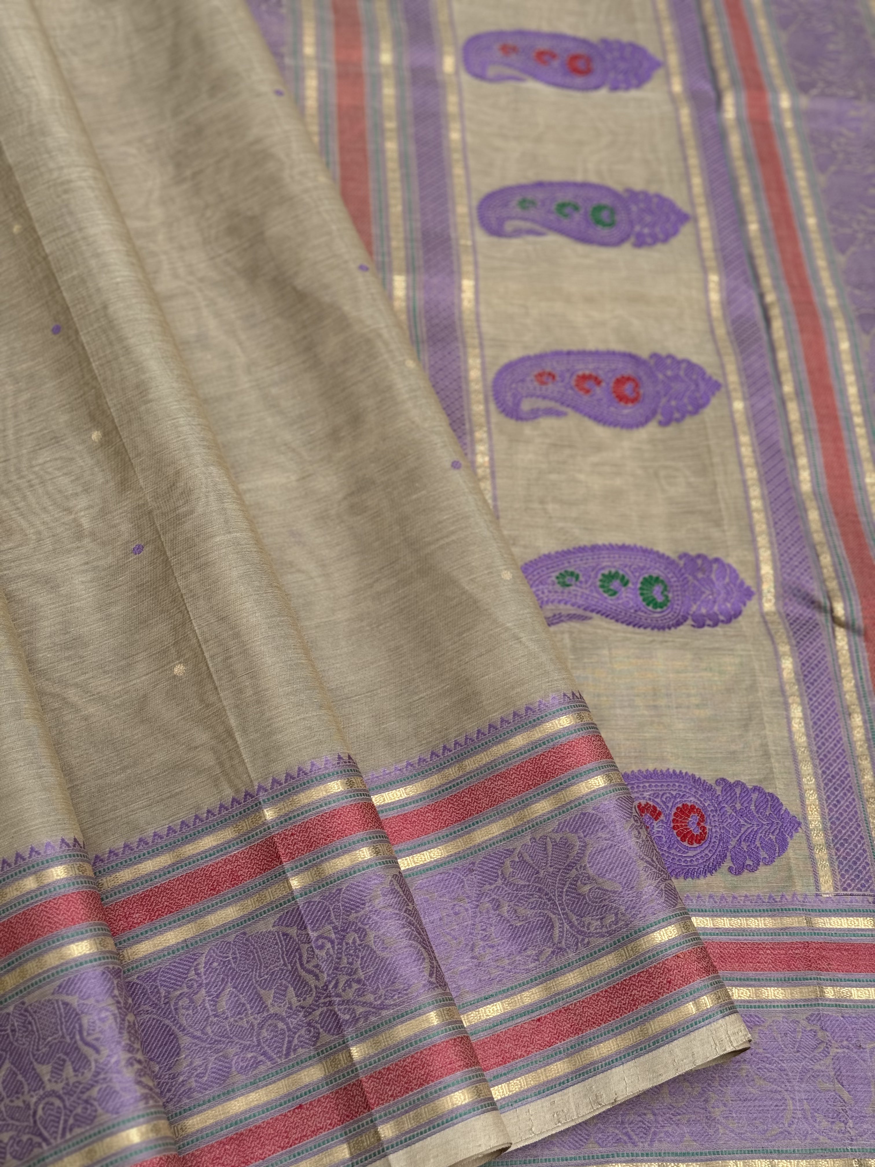 A gorgeous molten gold with lavender shade handwoven meenakari paisley buttas kanchi silk cotton saree