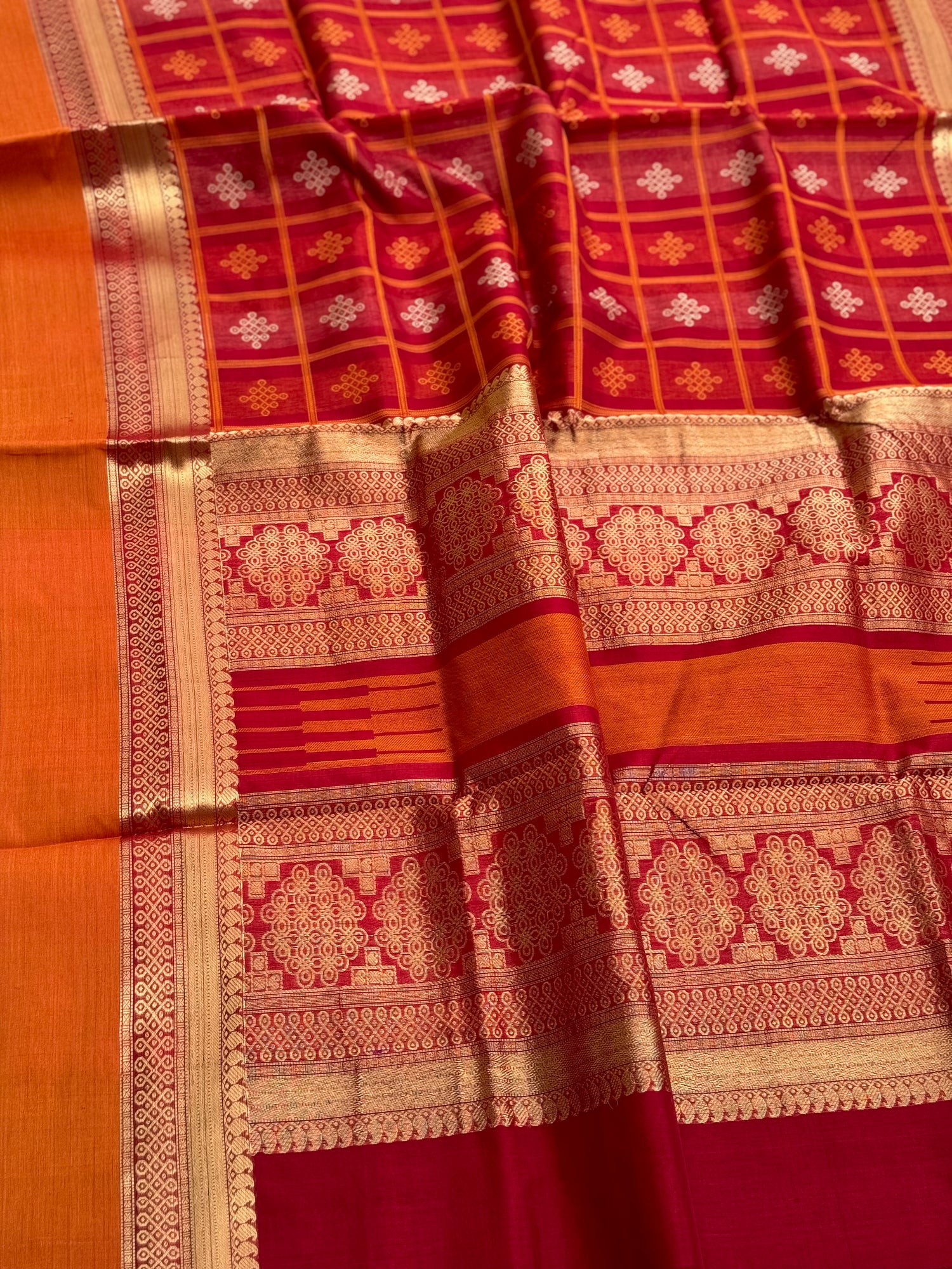 A gorgeous red shade handwoven Kolam motifs silk cotton saree