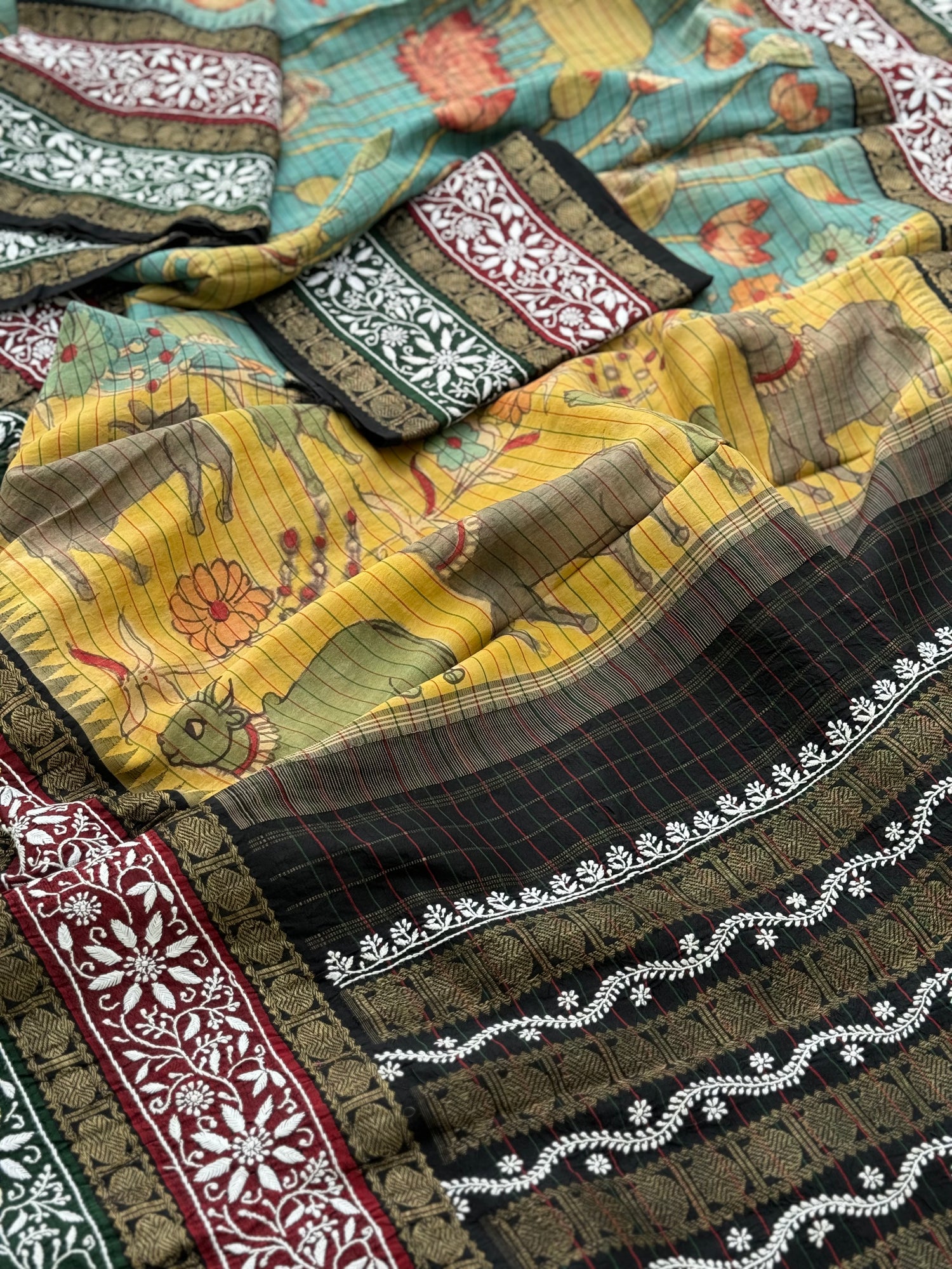 A korvai kanchivaram silk saree with penkalamkari and handmade chikankari embroidered work