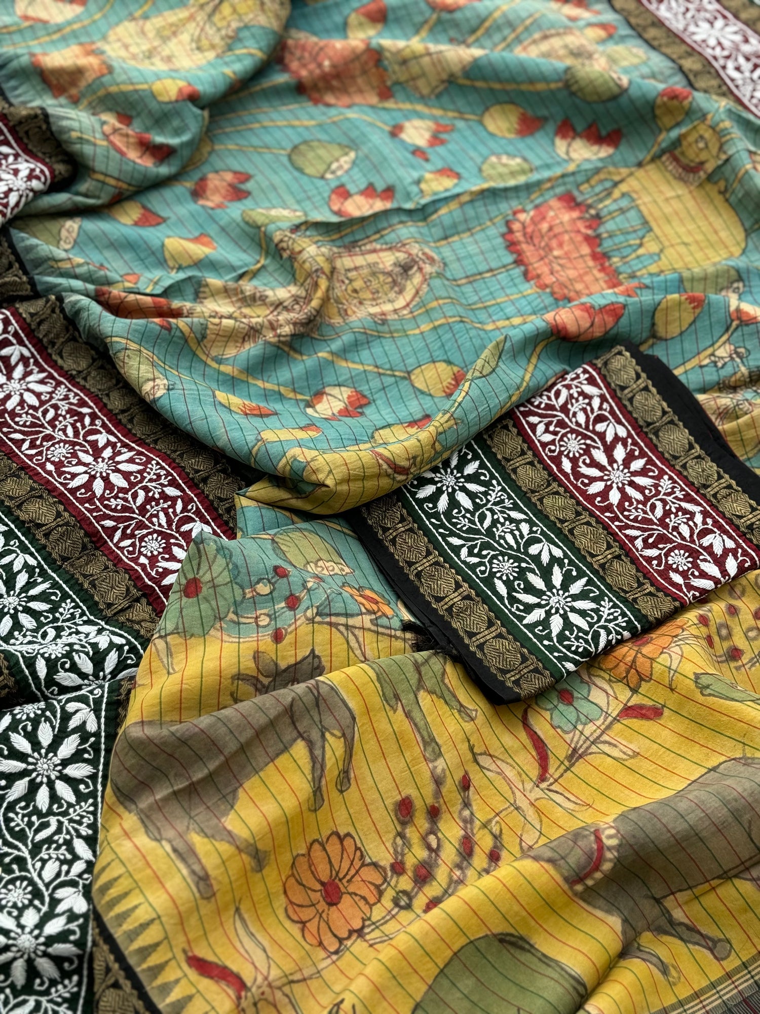 A korvai kanchivaram silk saree with penkalamkari and handmade chikankari embroidered work