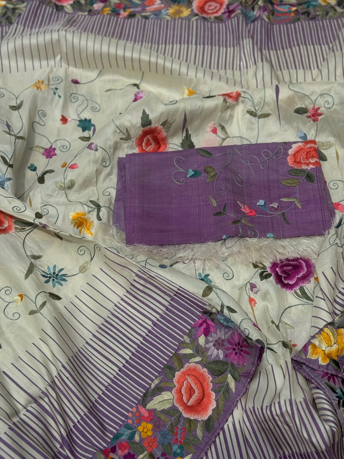 A stupendous kanchivaram silk saree in pastel lavender With authentic Parsi Gara work handmade