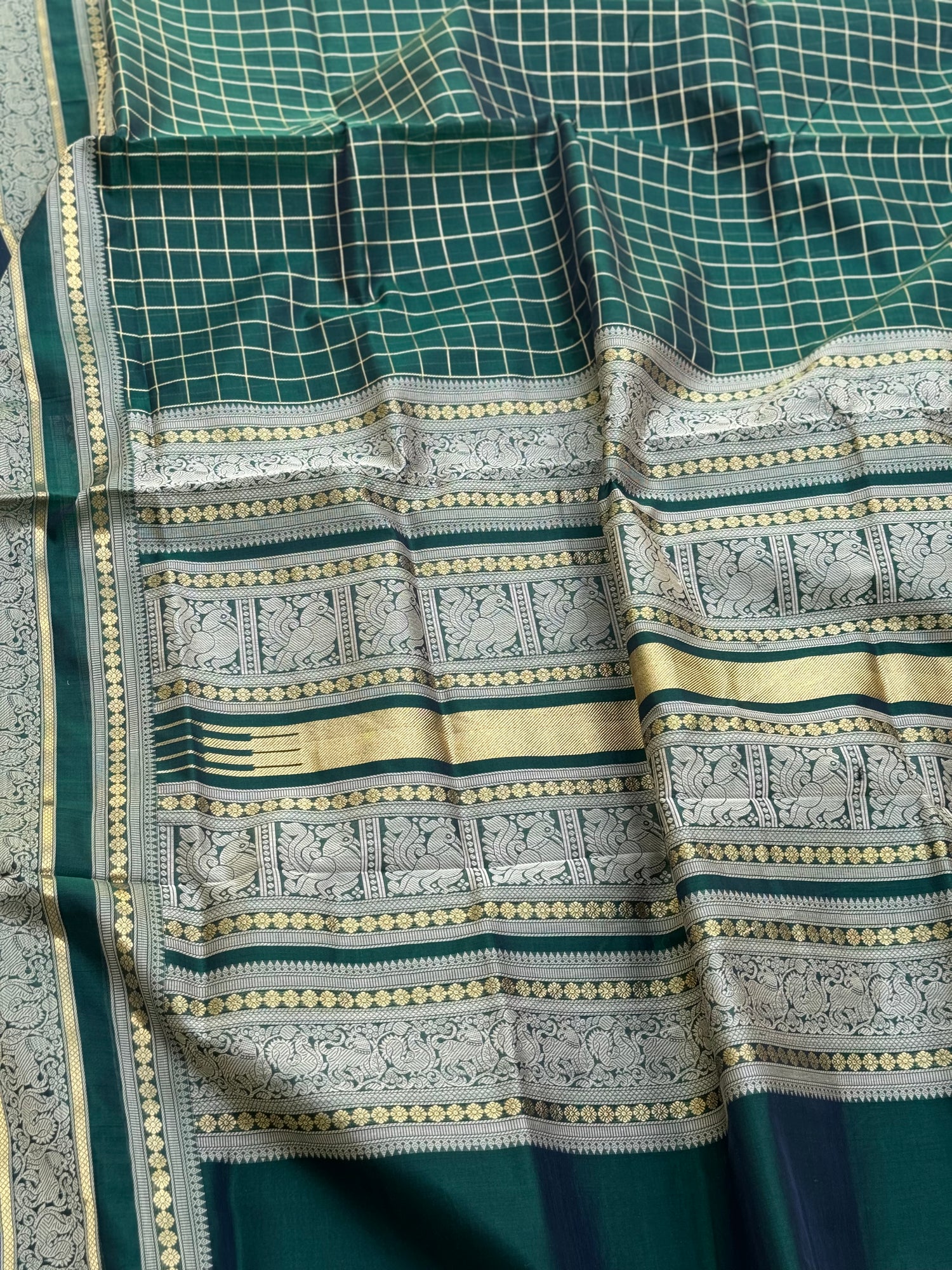 A gorgeous bottlegreen shade handwoven kattam Kanchi  silk cotton saree