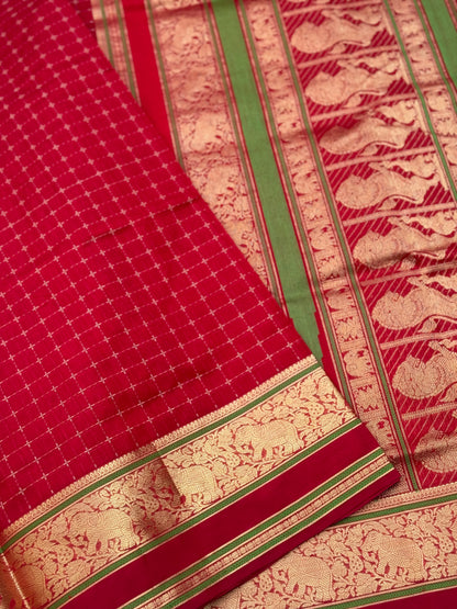 A gorgeous scarlet red shade handwoven plus buttas  silk cotton saree