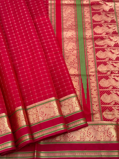 A gorgeous scarlet red shade handwoven plus buttas  silk cotton saree