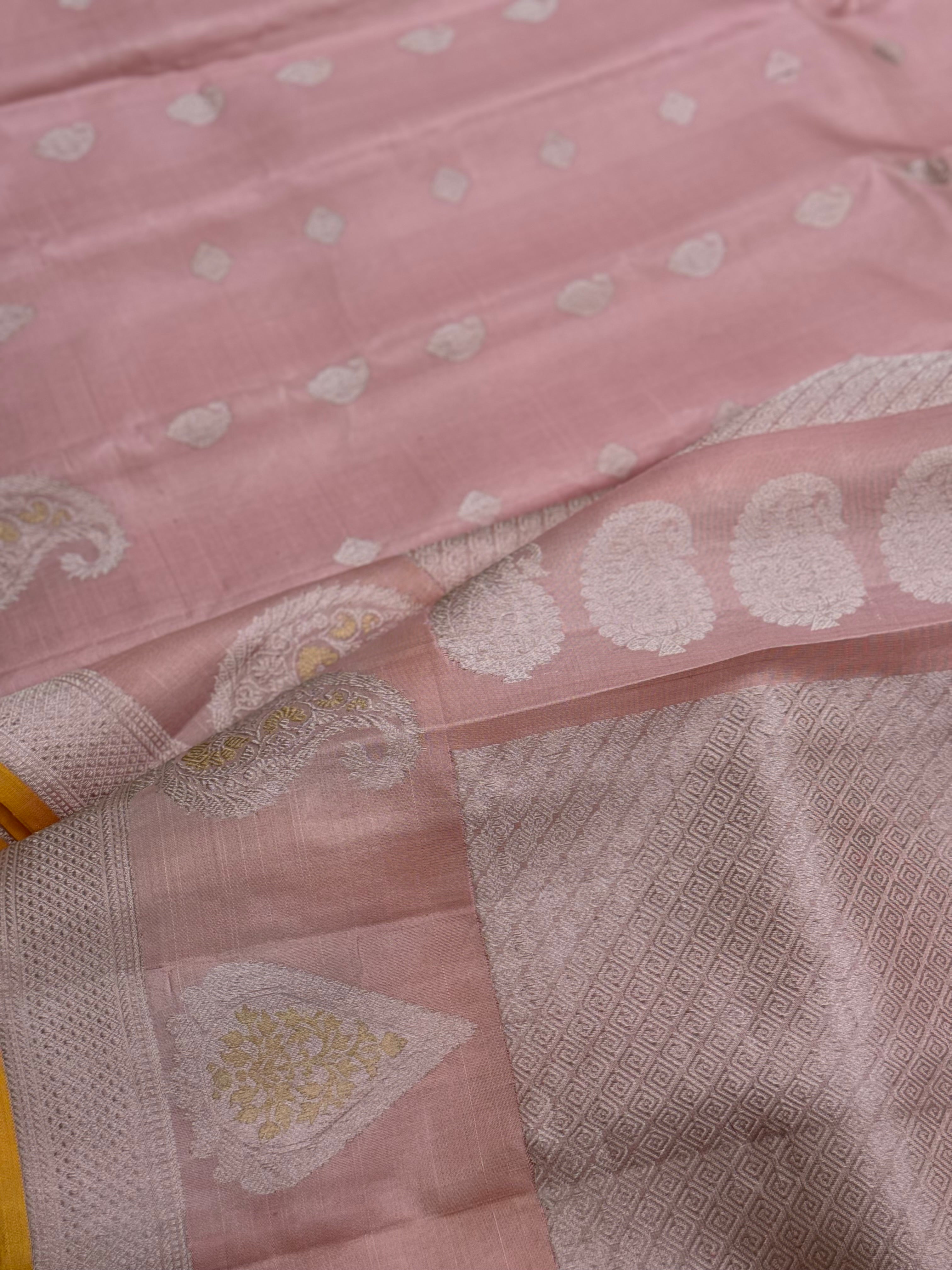 A gorgeous pastel baby pink with orange yellow handwoven gadwal silk saree