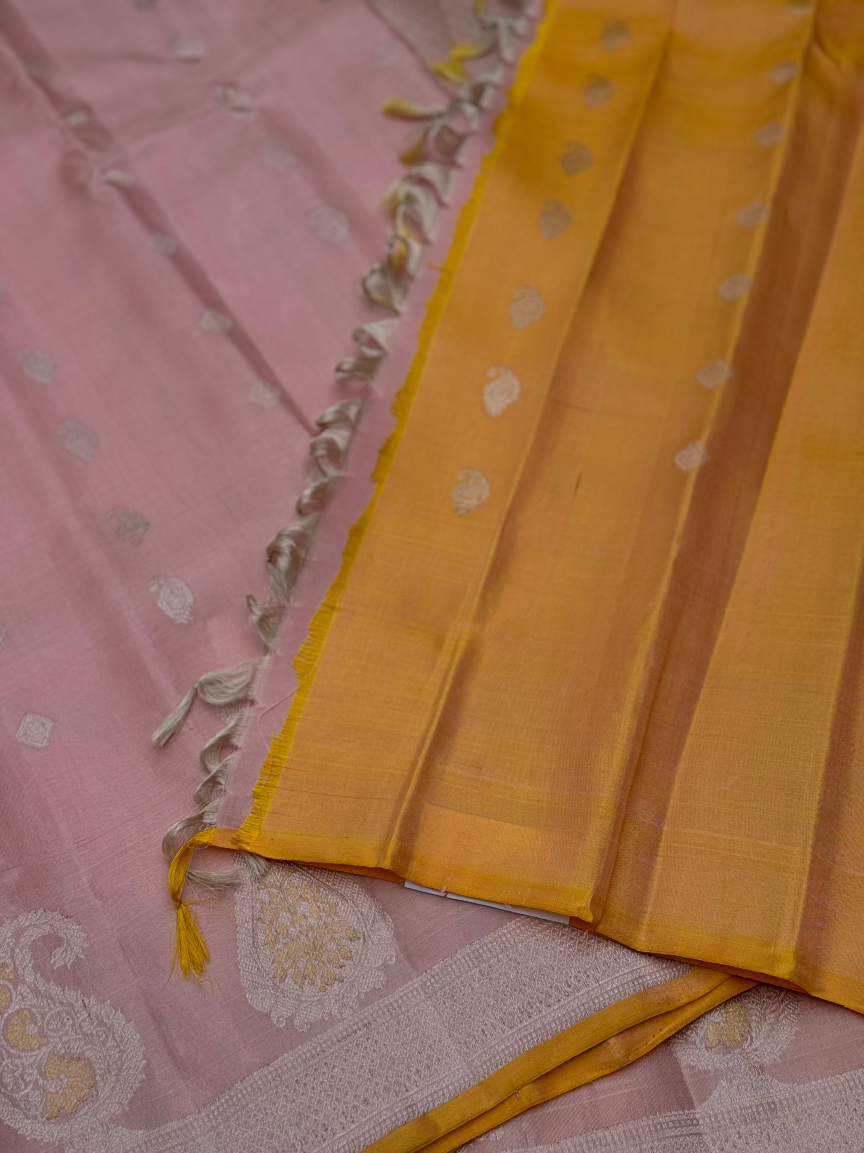 A gorgeous pastel baby pink with orange yellow handwoven gadwal silk saree