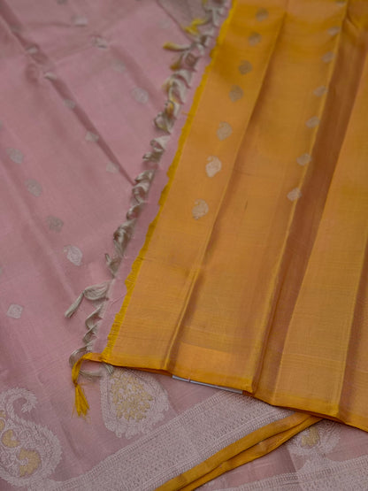 A gorgeous pastel baby pink with orange yellow handwoven gadwal silk saree