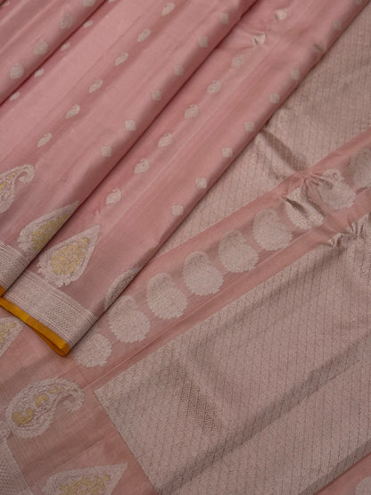 A gorgeous pastel baby pink with orange yellow handwoven gadwal silk saree