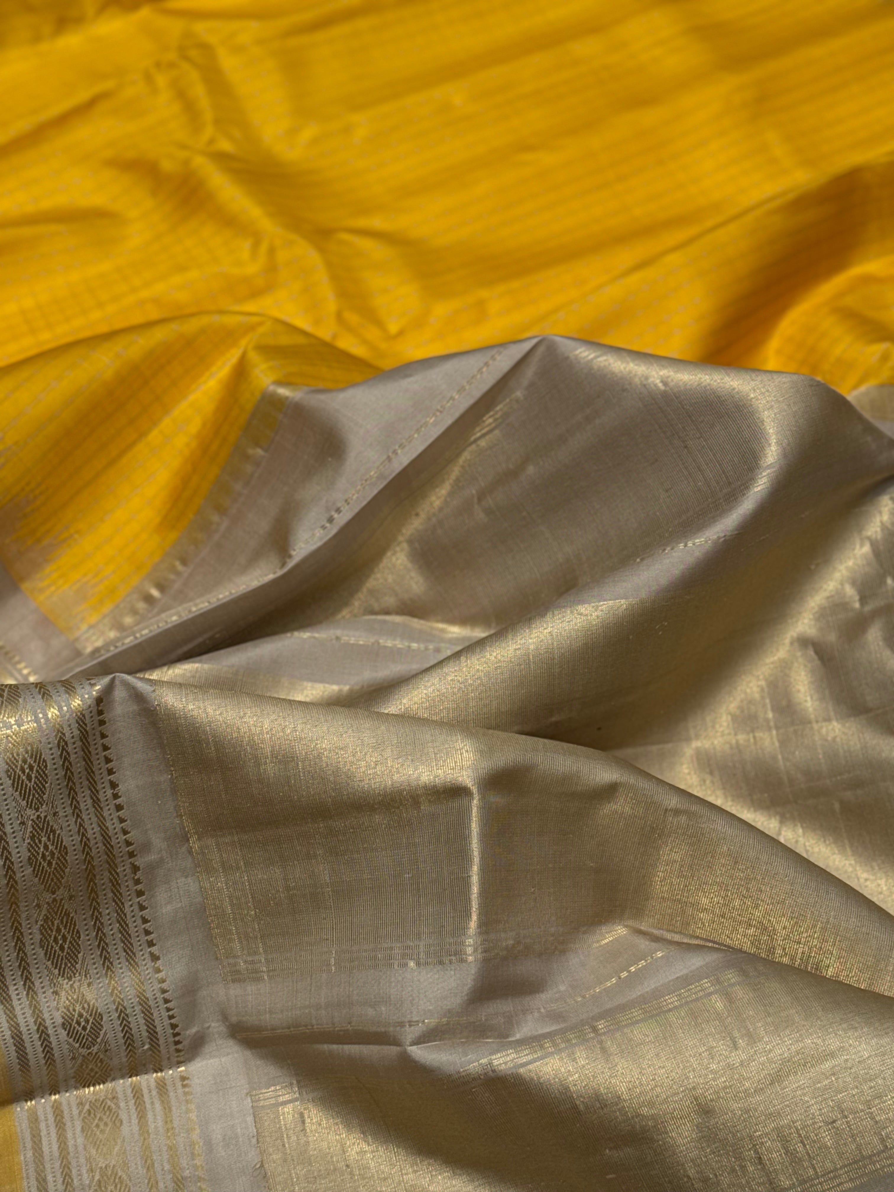 gorgeous offwhite with sunset yellow striped temple border kuttu handwoven gadwal silk saree