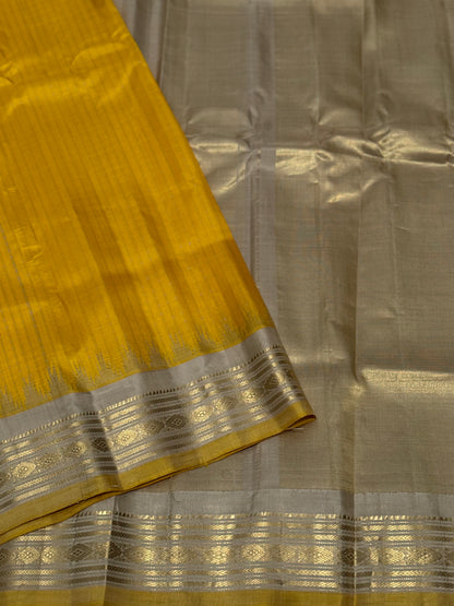 gorgeous offwhite with sunset yellow striped temple border kuttu handwoven gadwal silk saree