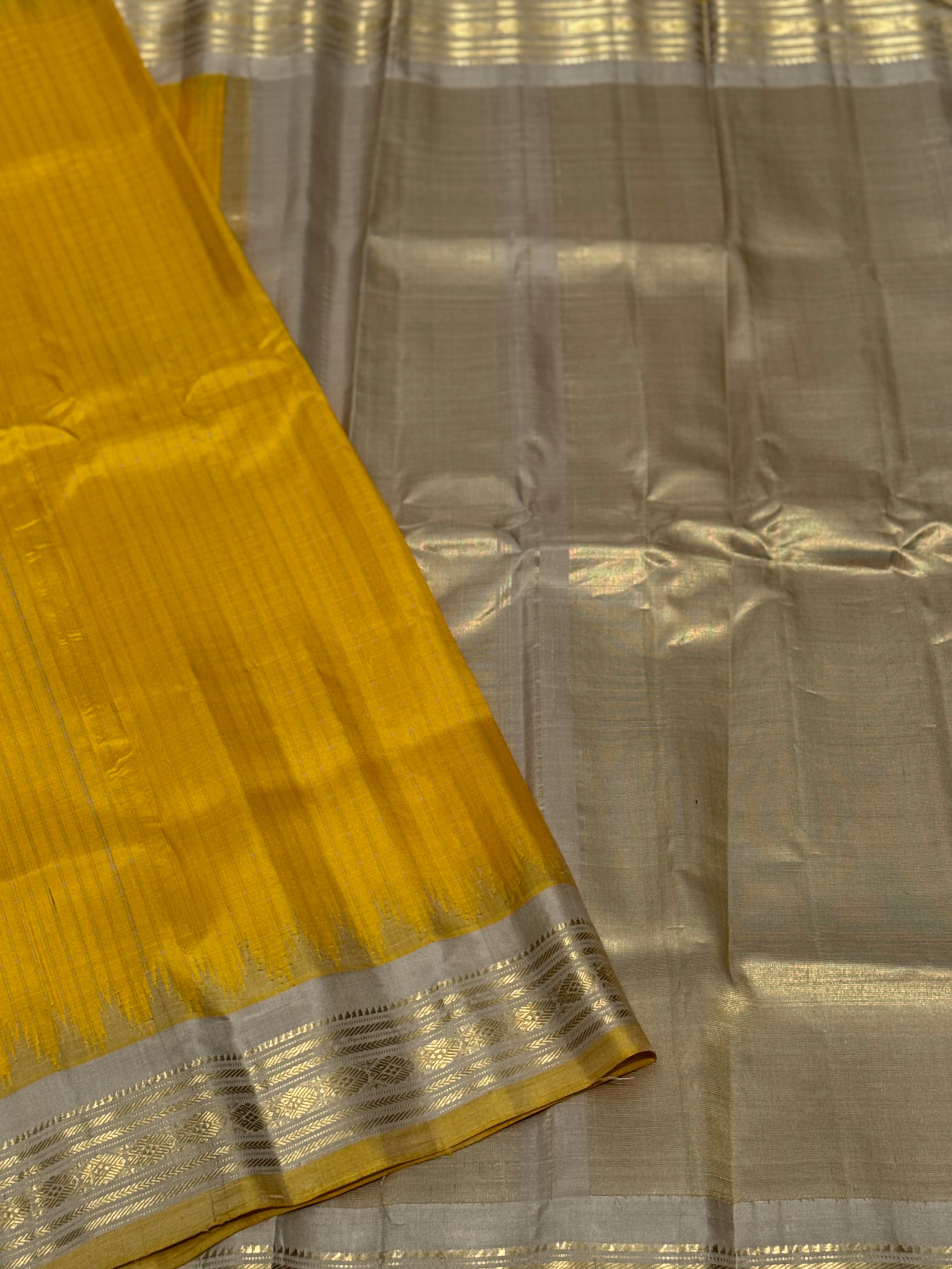gorgeous offwhite with sunset yellow striped temple border kuttu handwoven gadwal silk saree