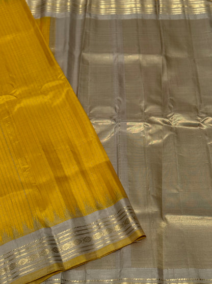 gorgeous offwhite with sunset yellow striped temple border kuttu handwoven gadwal silk saree