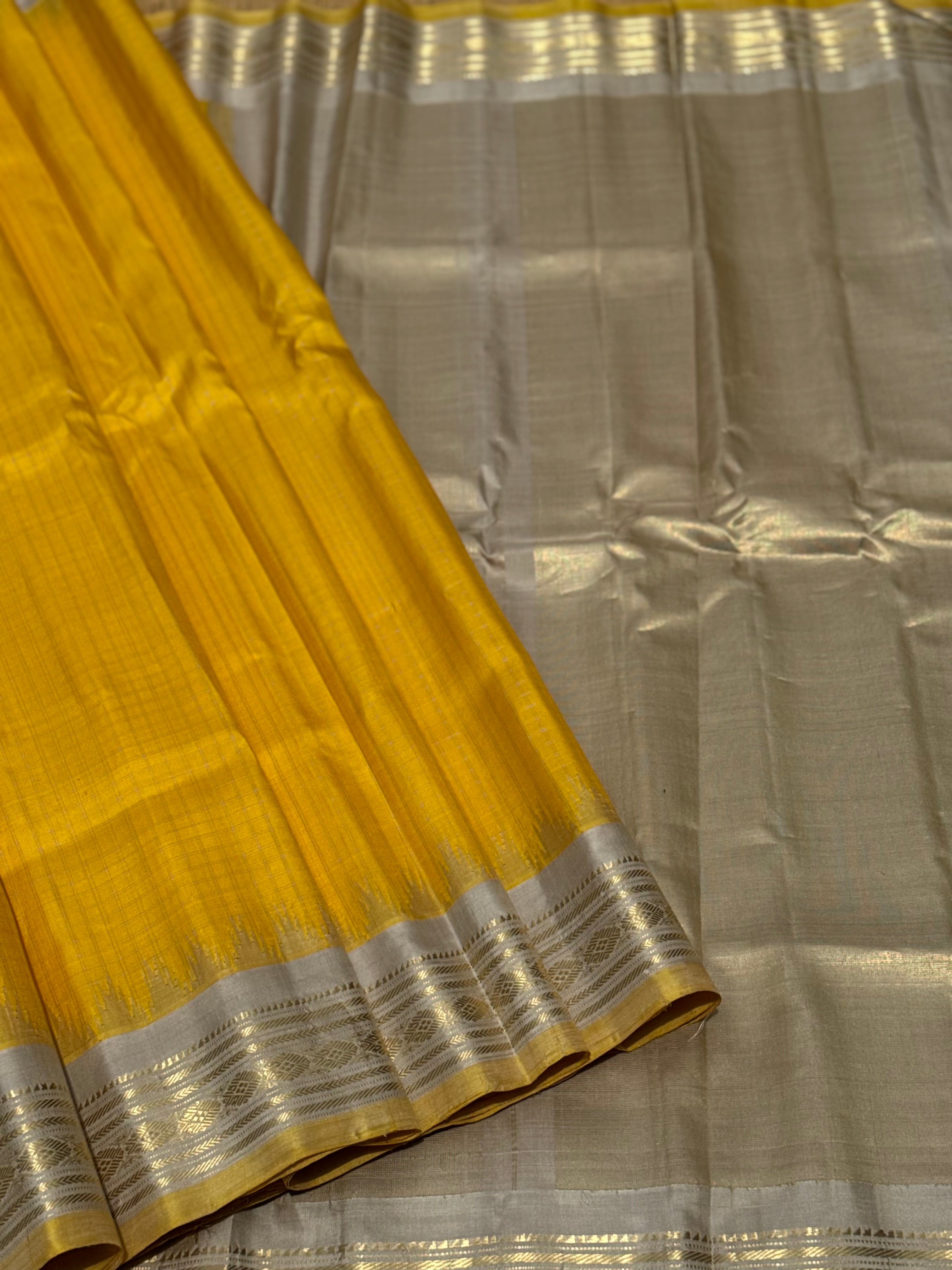 gorgeous offwhite with sunset yellow striped temple border kuttu handwoven gadwal silk saree