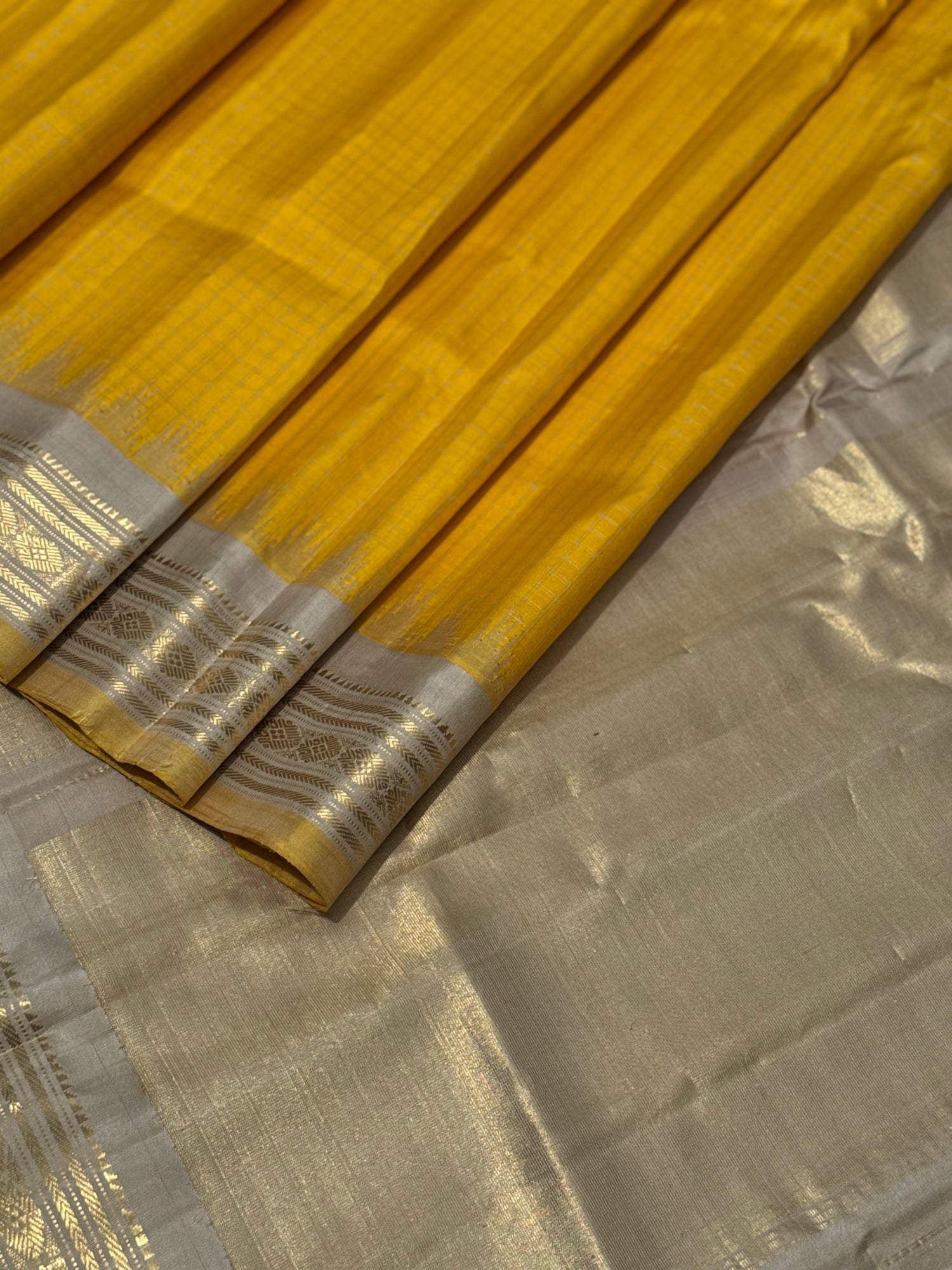 gorgeous offwhite with sunset yellow striped temple border kuttu handwoven gadwal silk saree