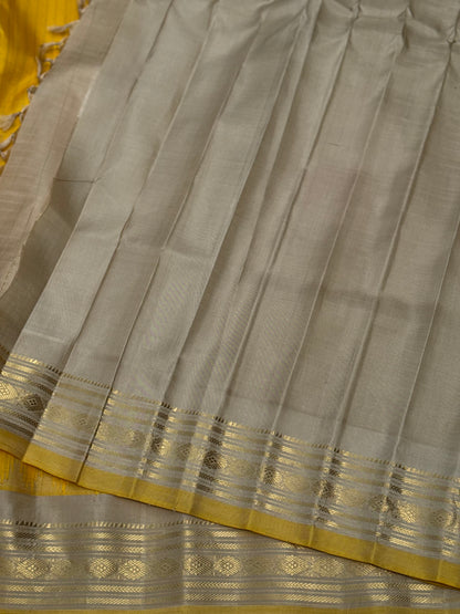 gorgeous offwhite with sunset yellow striped temple border kuttu handwoven gadwal silk saree