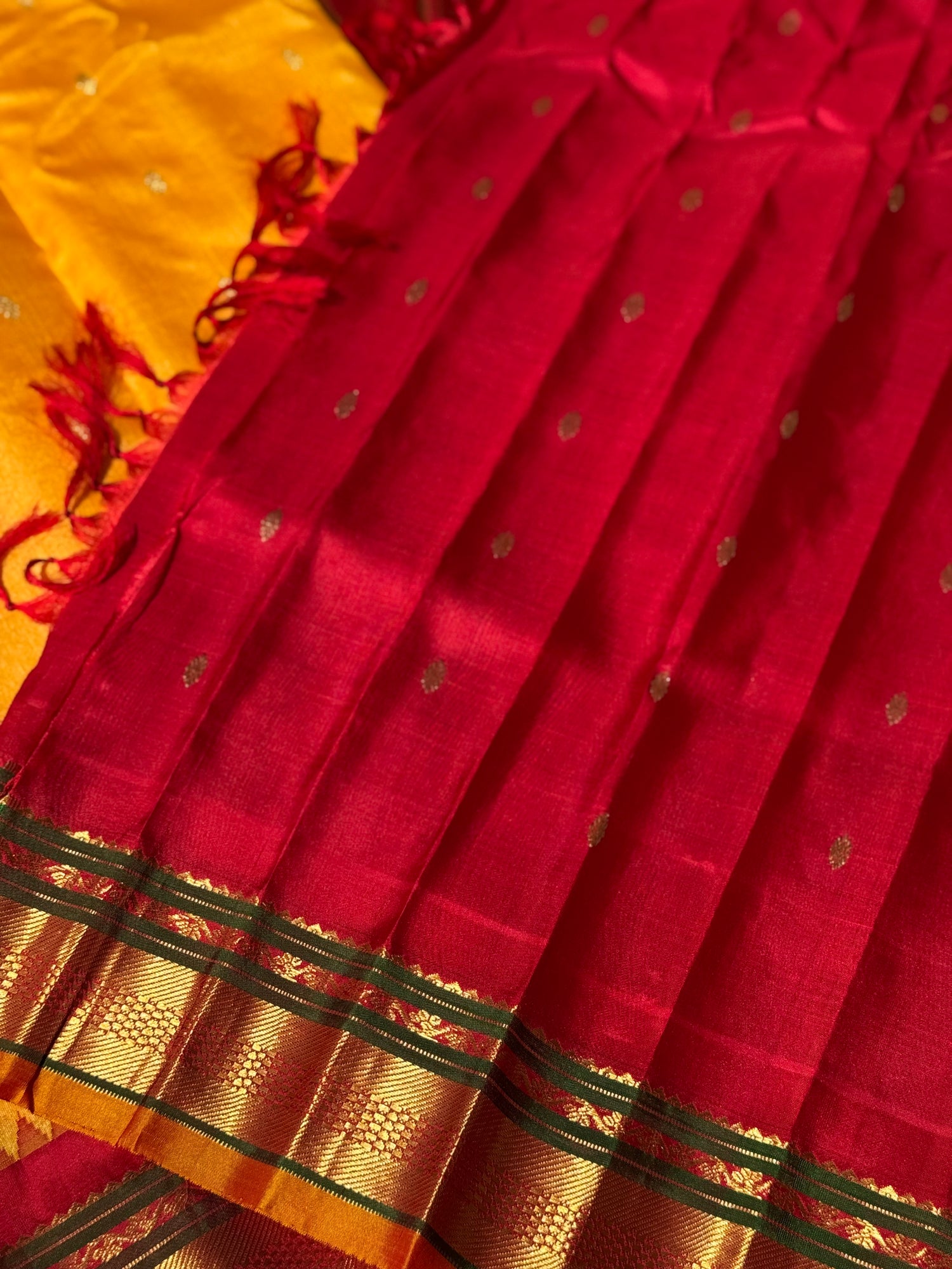 A gorgeous turmeric yellow with red temple border kuttu handwoven gadwal silk saree