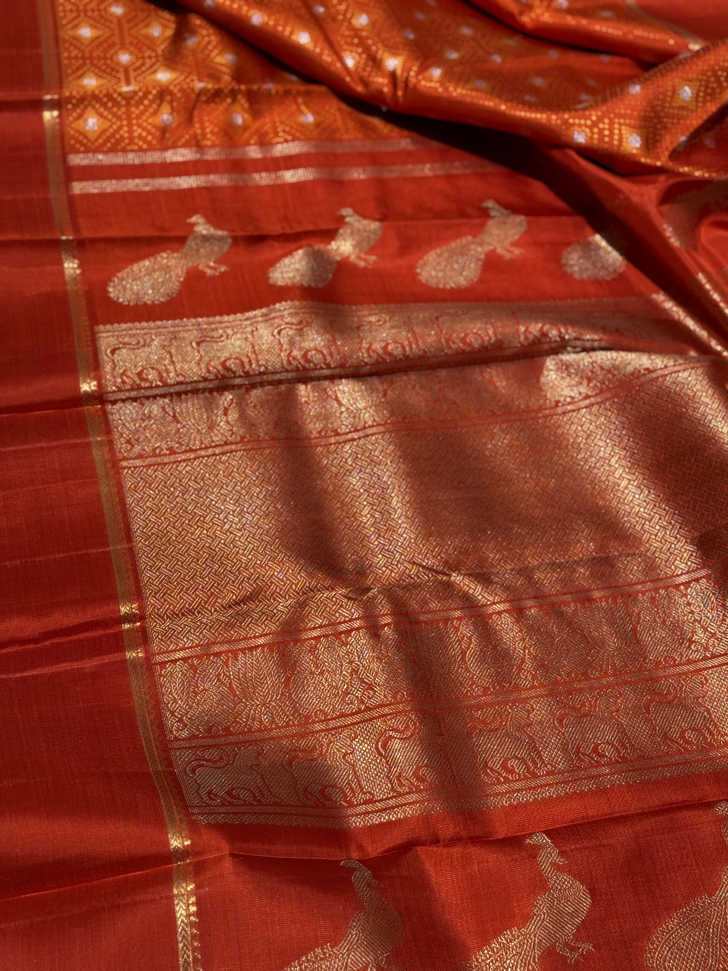 An awe inspiring masterpiece rustic orange shade bhandini inspired kanchivaram silk saree masterpiece