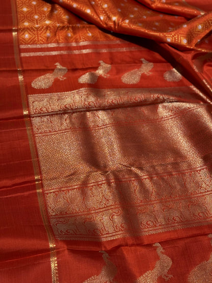 An awe inspiring masterpiece rustic orange shade bhandini inspired kanchivaram silk saree masterpiece