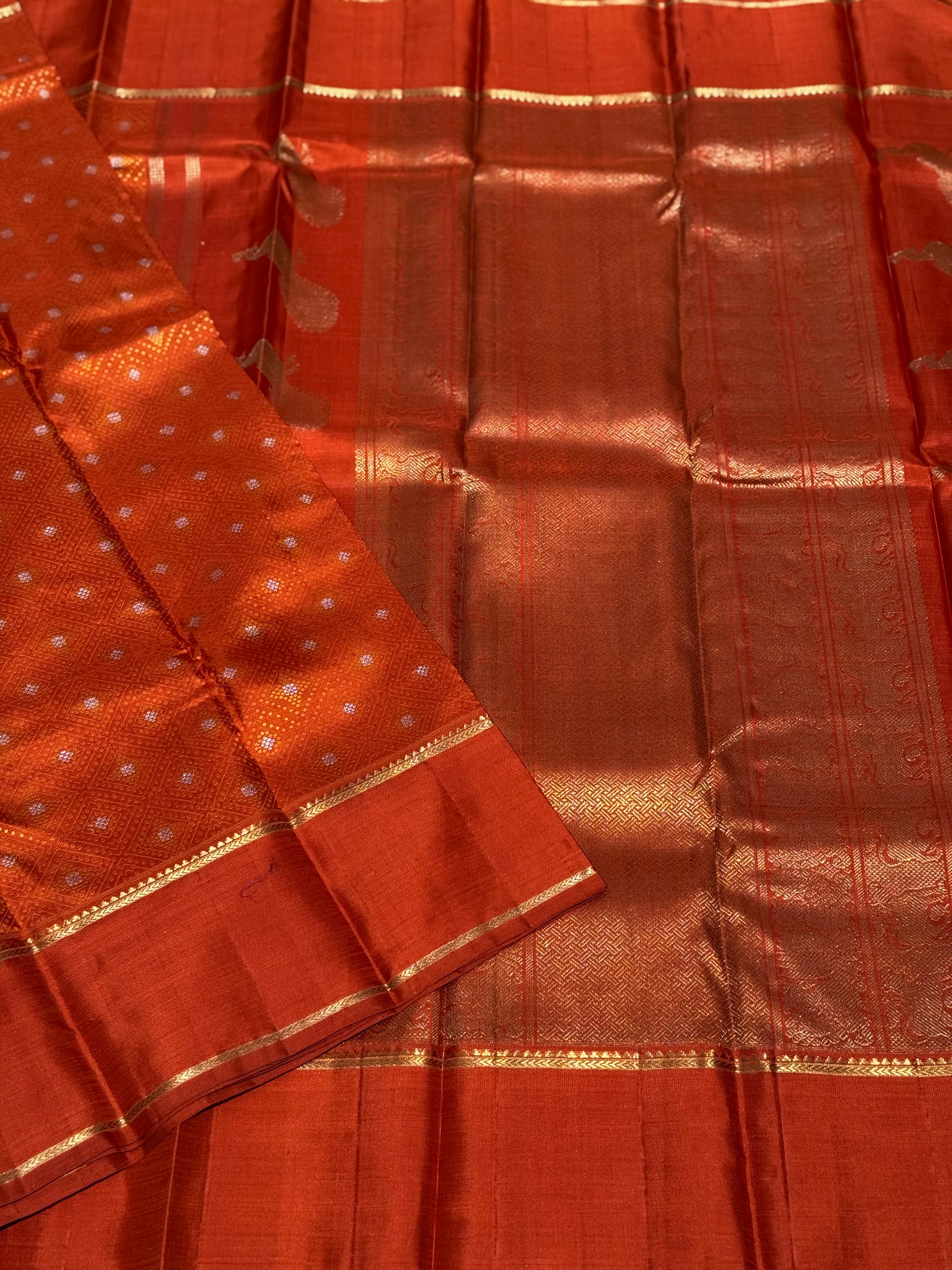 An awe inspiring masterpiece rustic orange shade bhandini inspired kanchivaram silk saree masterpiece