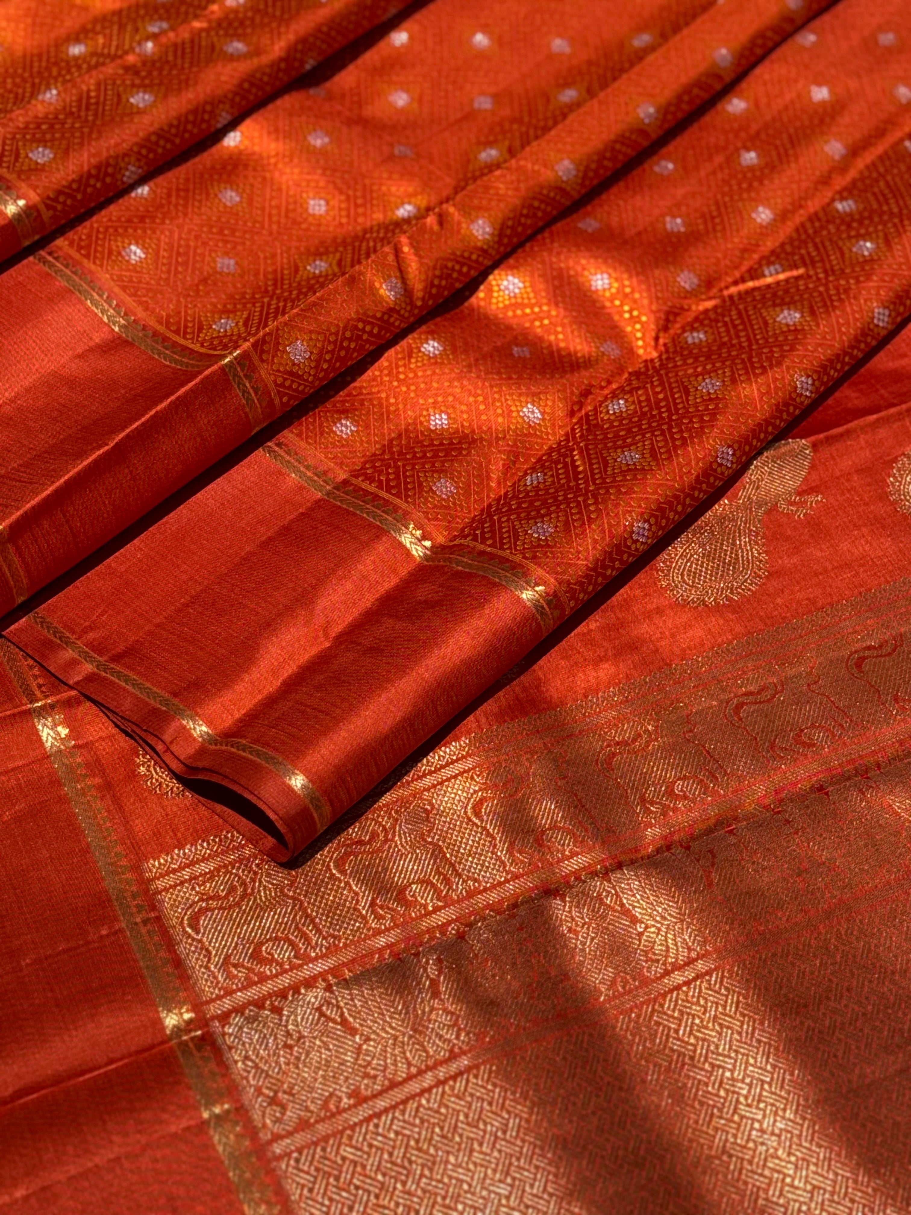 An awe inspiring masterpiece rustic orange shade bhandini inspired kanchivaram silk saree masterpiece